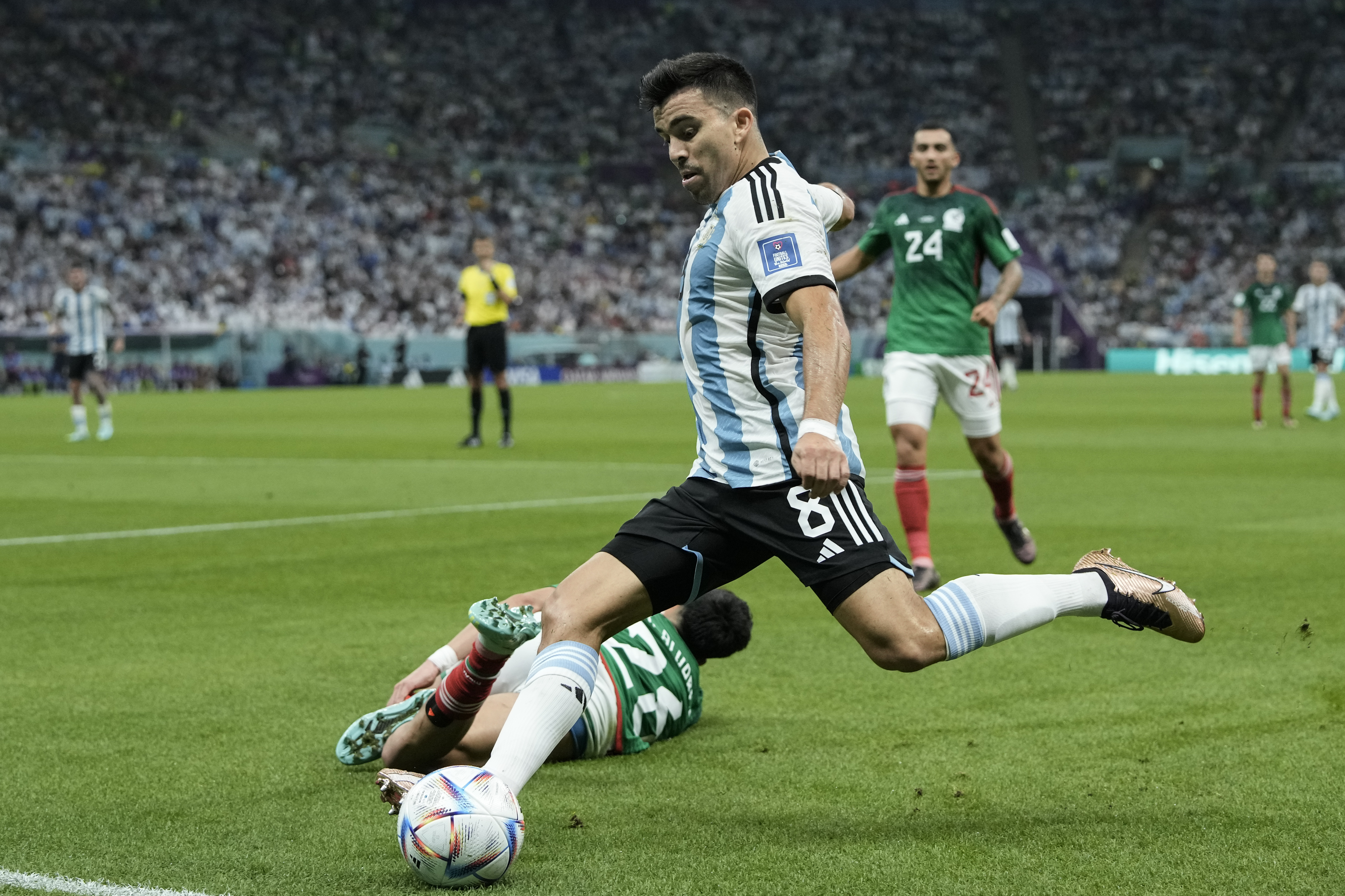 Argentina's Marcos Acuna kicks the ball during the World Cup match between Argentina and Mexico.