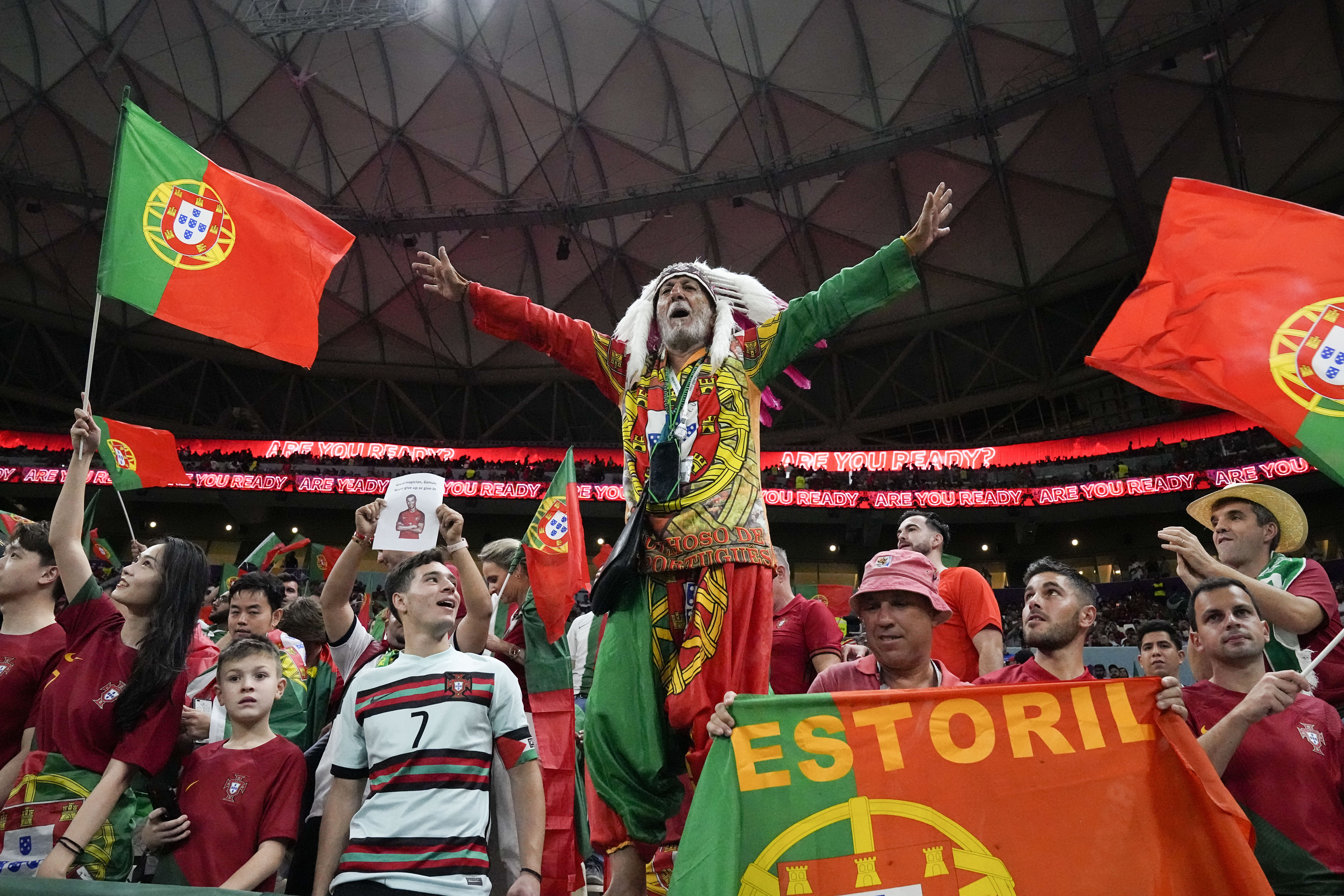 Fans cheer before the World Cup match between Portugal and Uruguay.