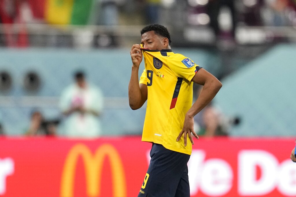 Plata wipes at his eyes with his t-shirt