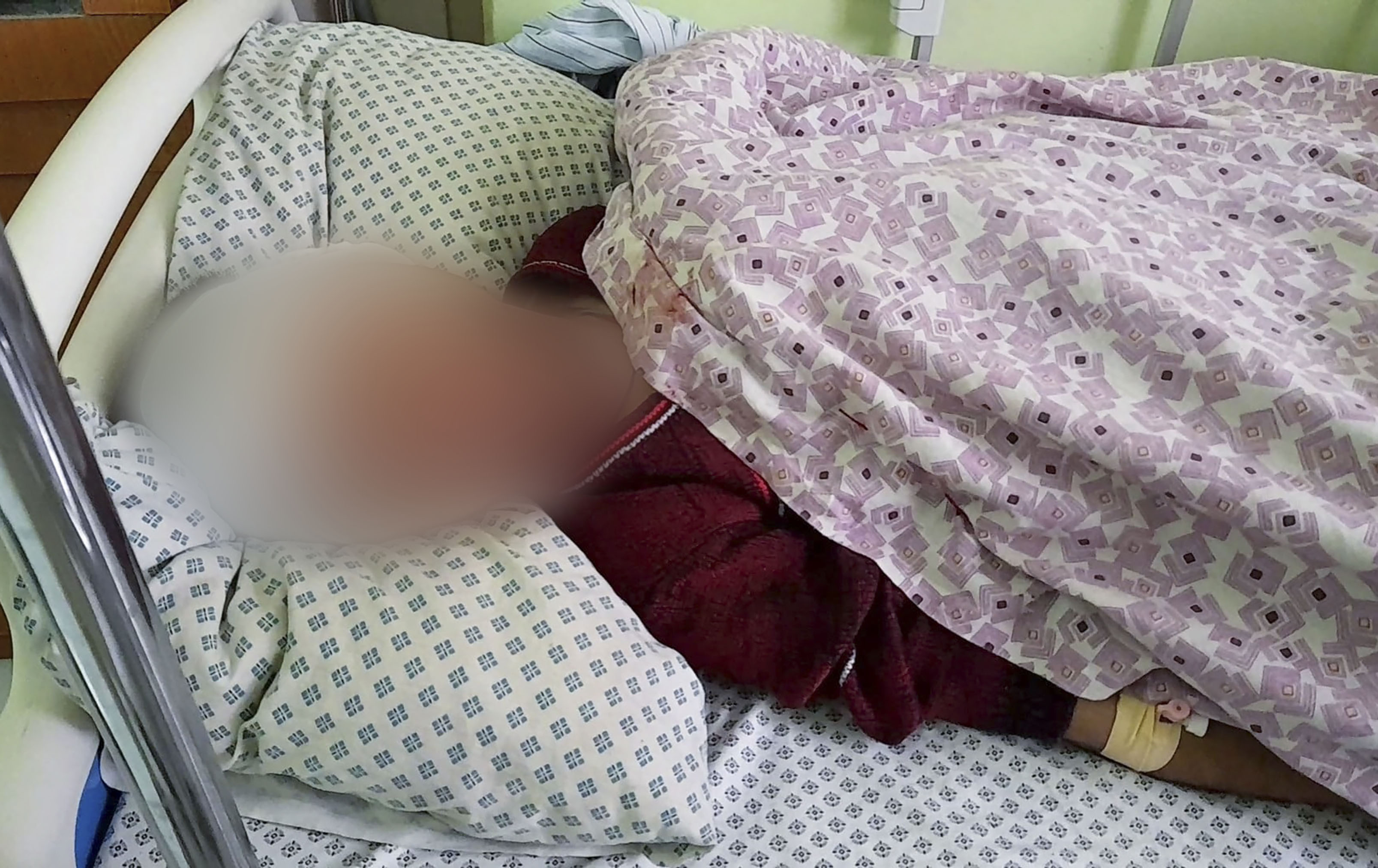 A wounded boy receives treatment at a hospital after a deadly bomb in Samangan province.