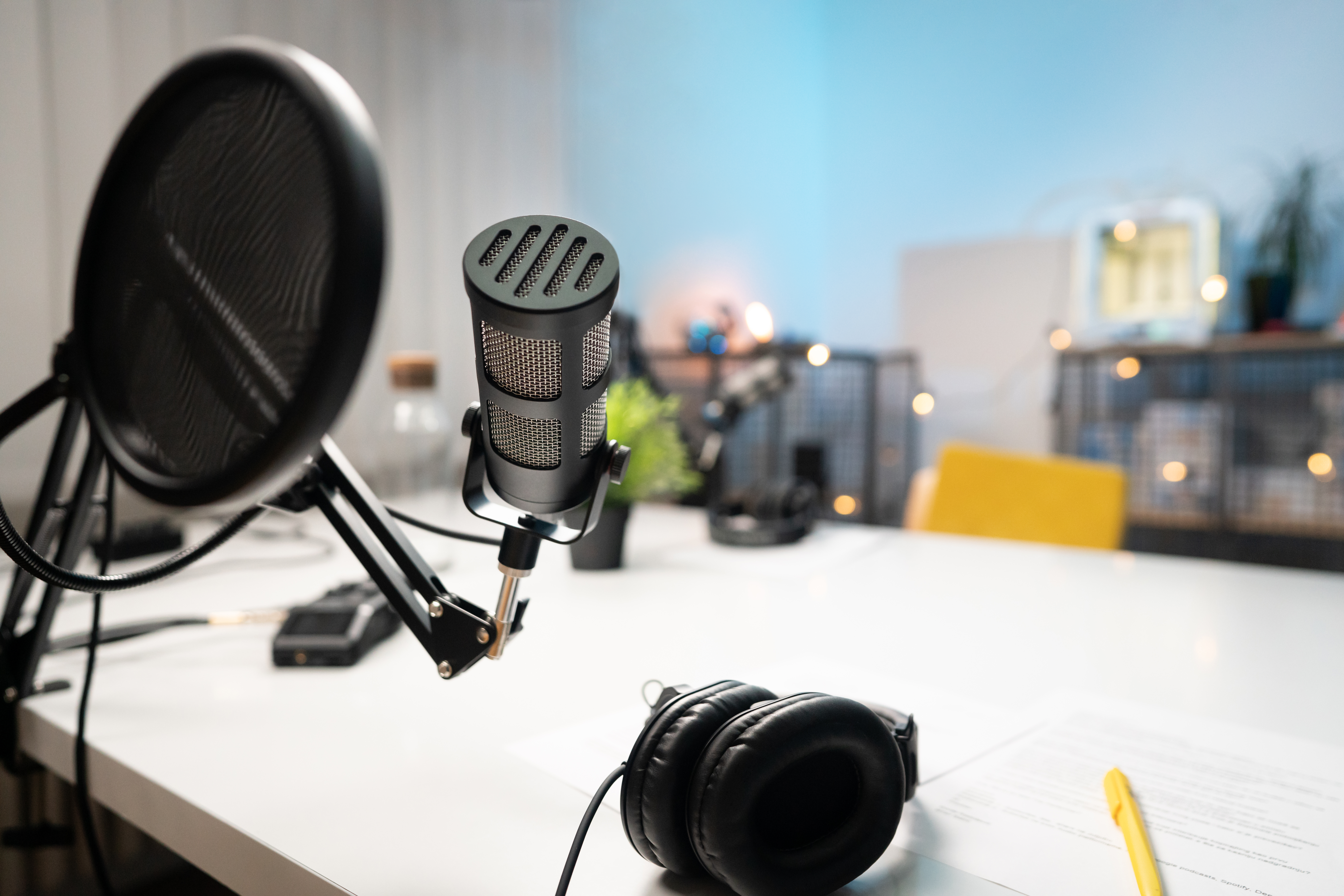 Podcast studio with audio, recording equipment, and technology.