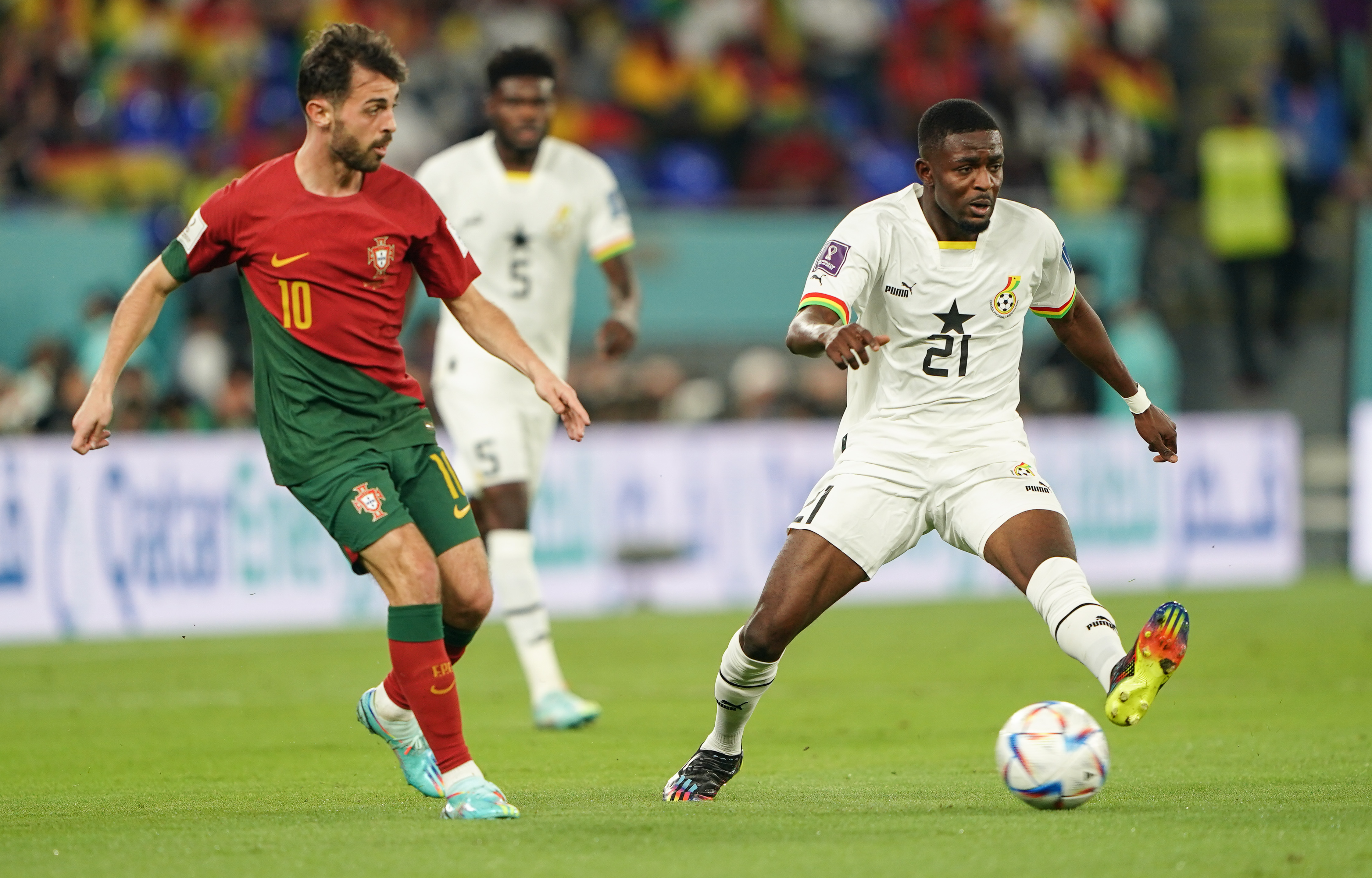 Players caught in action, Samed kicking the ball