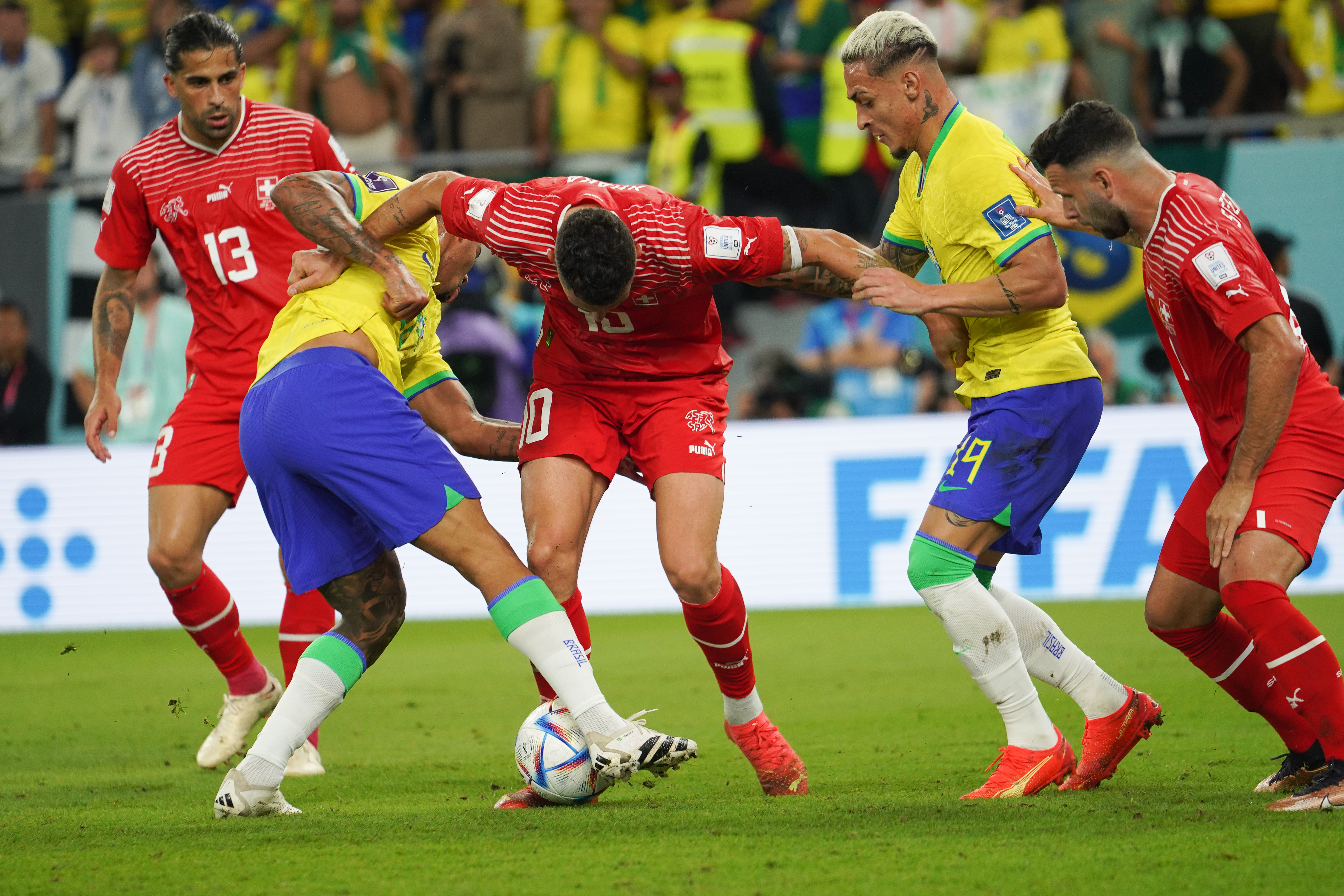 Granit Xhaka #10 struggles for possession with Gabriel Jesus #18 and Antony Santos #19