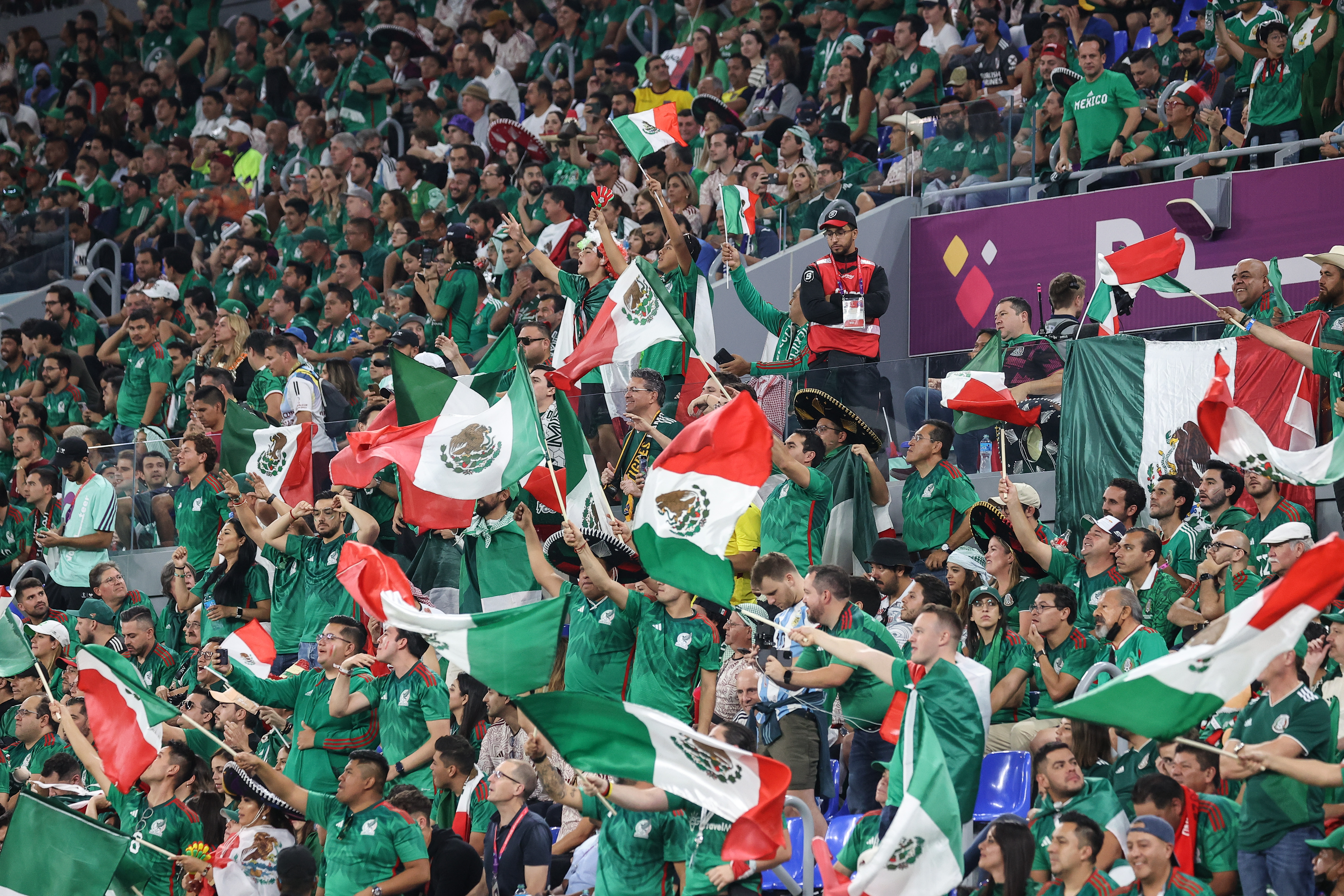 crowd already initiating a ubiquitous Mexican wave