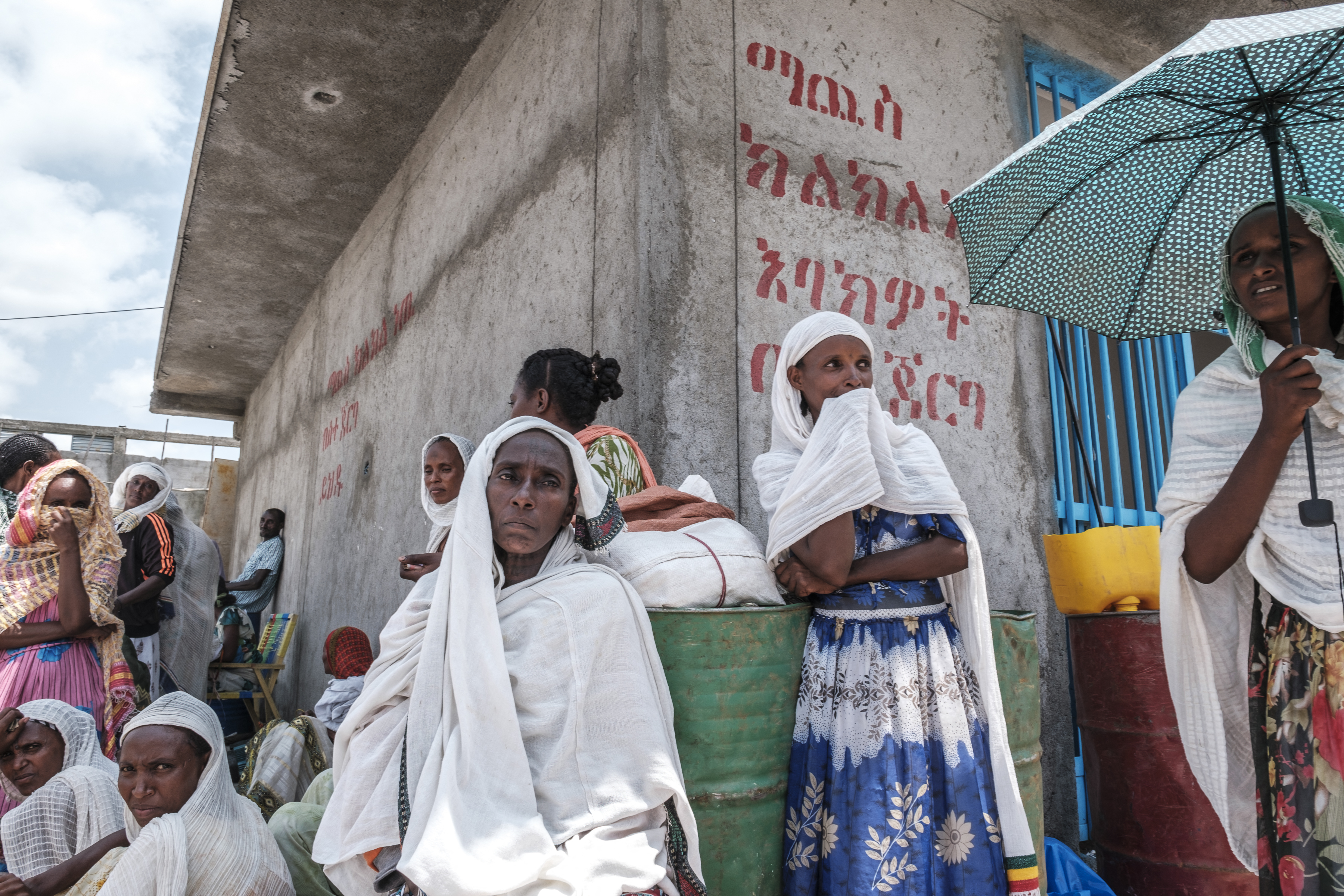 Women wait during a food distribution event organised by the Amhara government in the Tigray region of Ethiopia, July 11, 2021