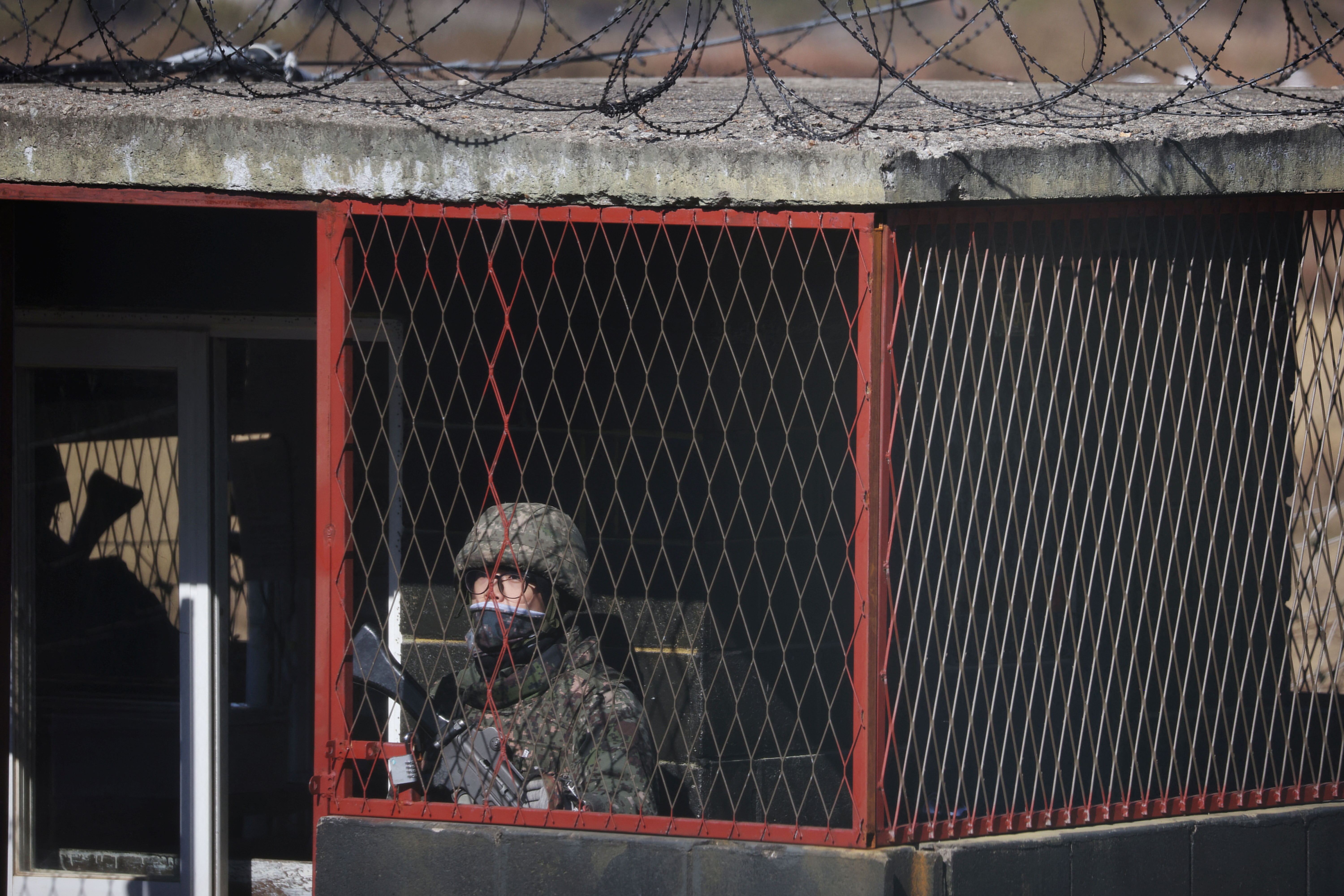 A South Korean soldier stands guard at a guard post near the demilitarized zone separating the two Koreas, in Paju, South Korea