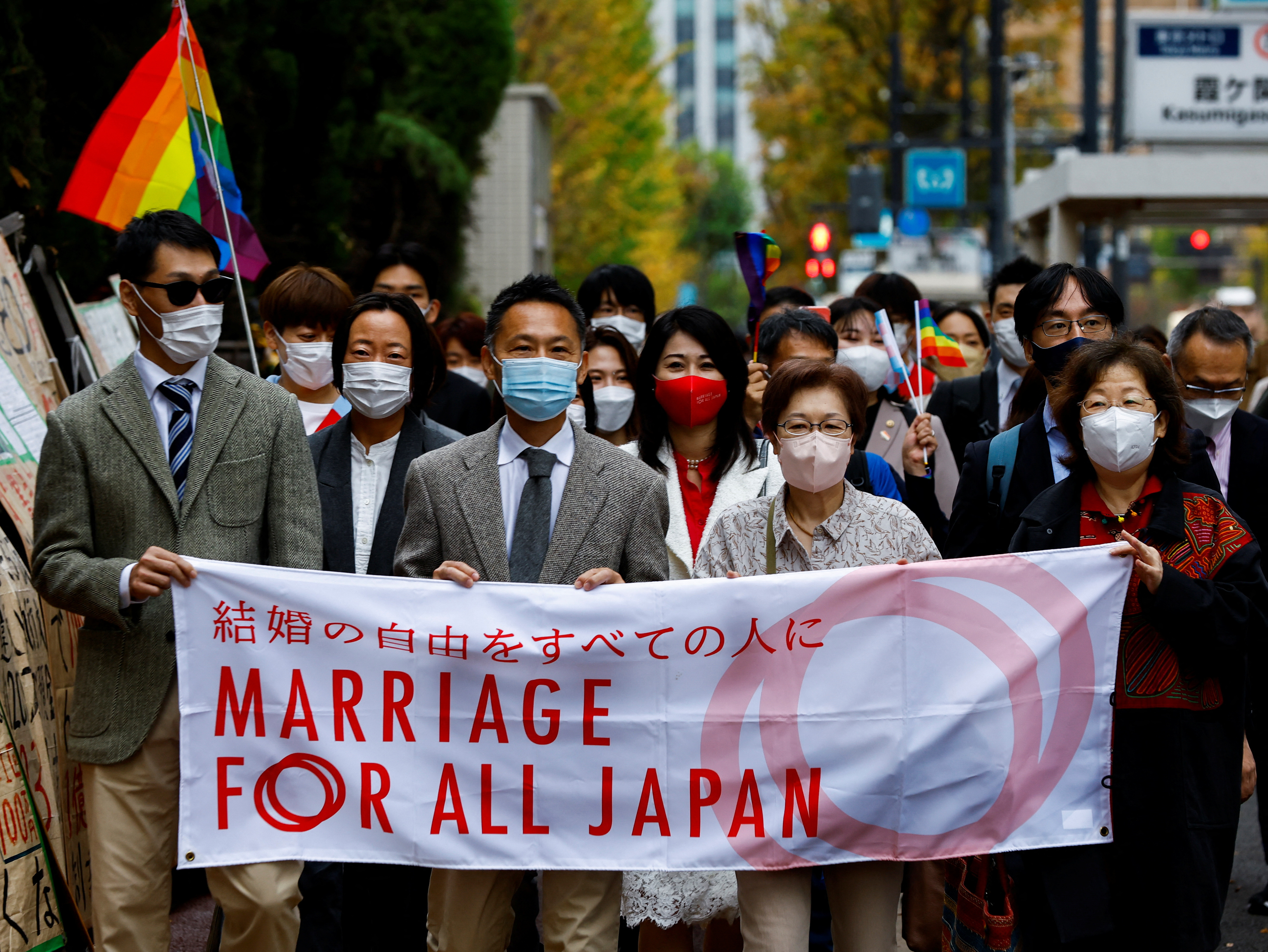 Plaintiffs, lawyers and supporters march as they head to the court which will rule on the constitutionality of same-sex marriage, in Tokyo, Japan