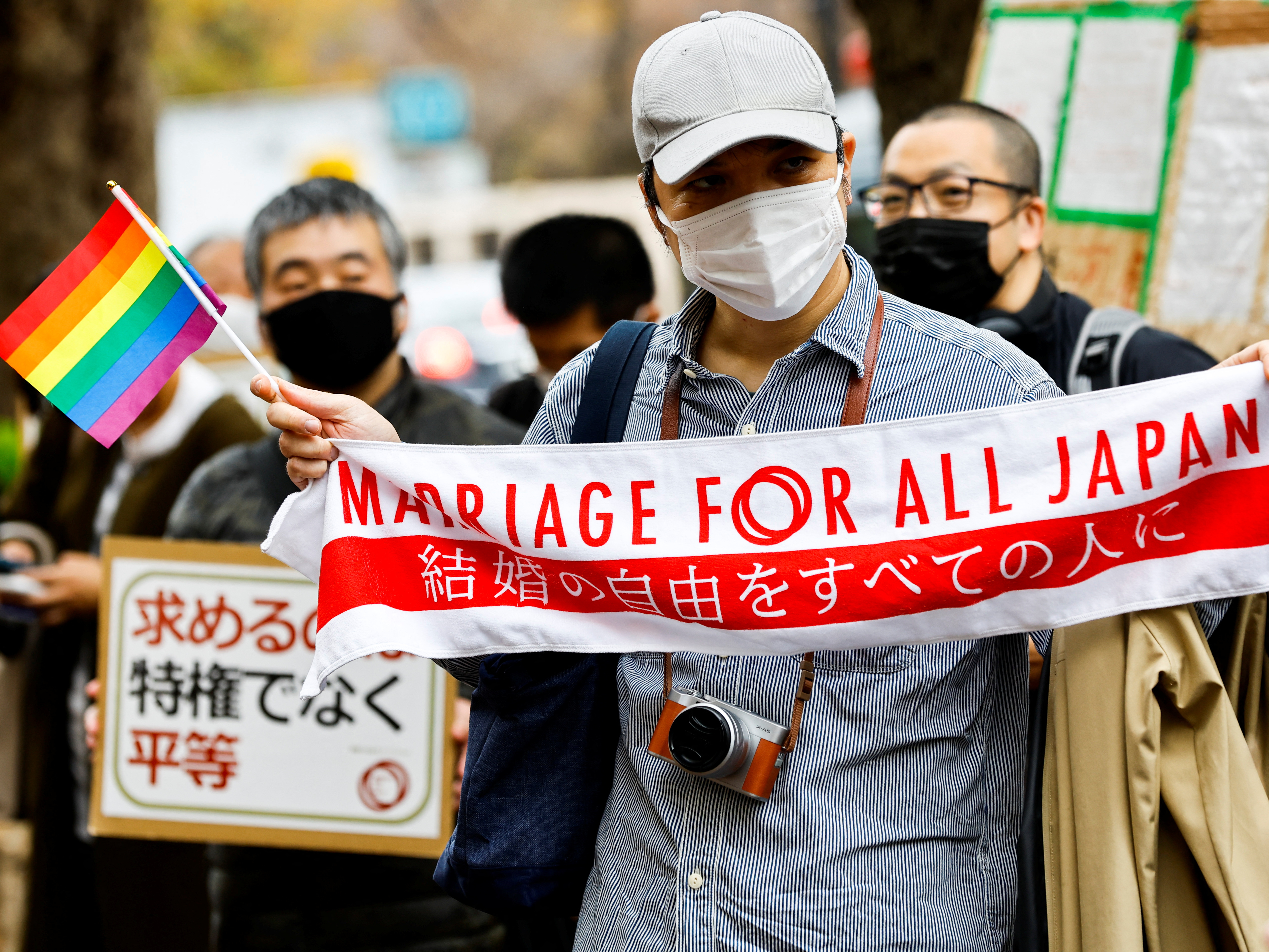 Supporters hold a banner that says 'Marriage for all Japan'