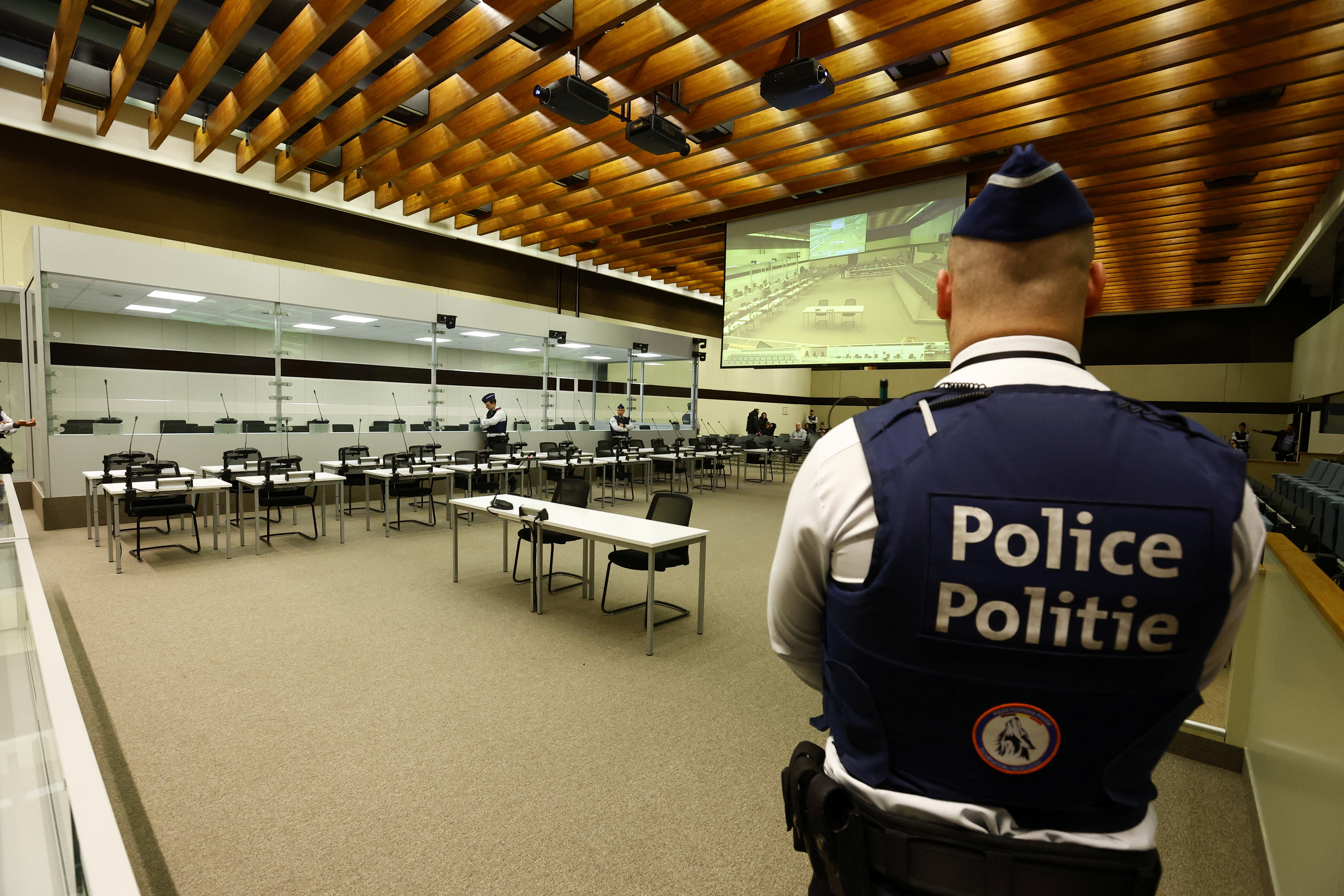 Police officers stand in the courtroom prior to the selection of the jury for the 2016 Brussels and Maelbeek attacks trial