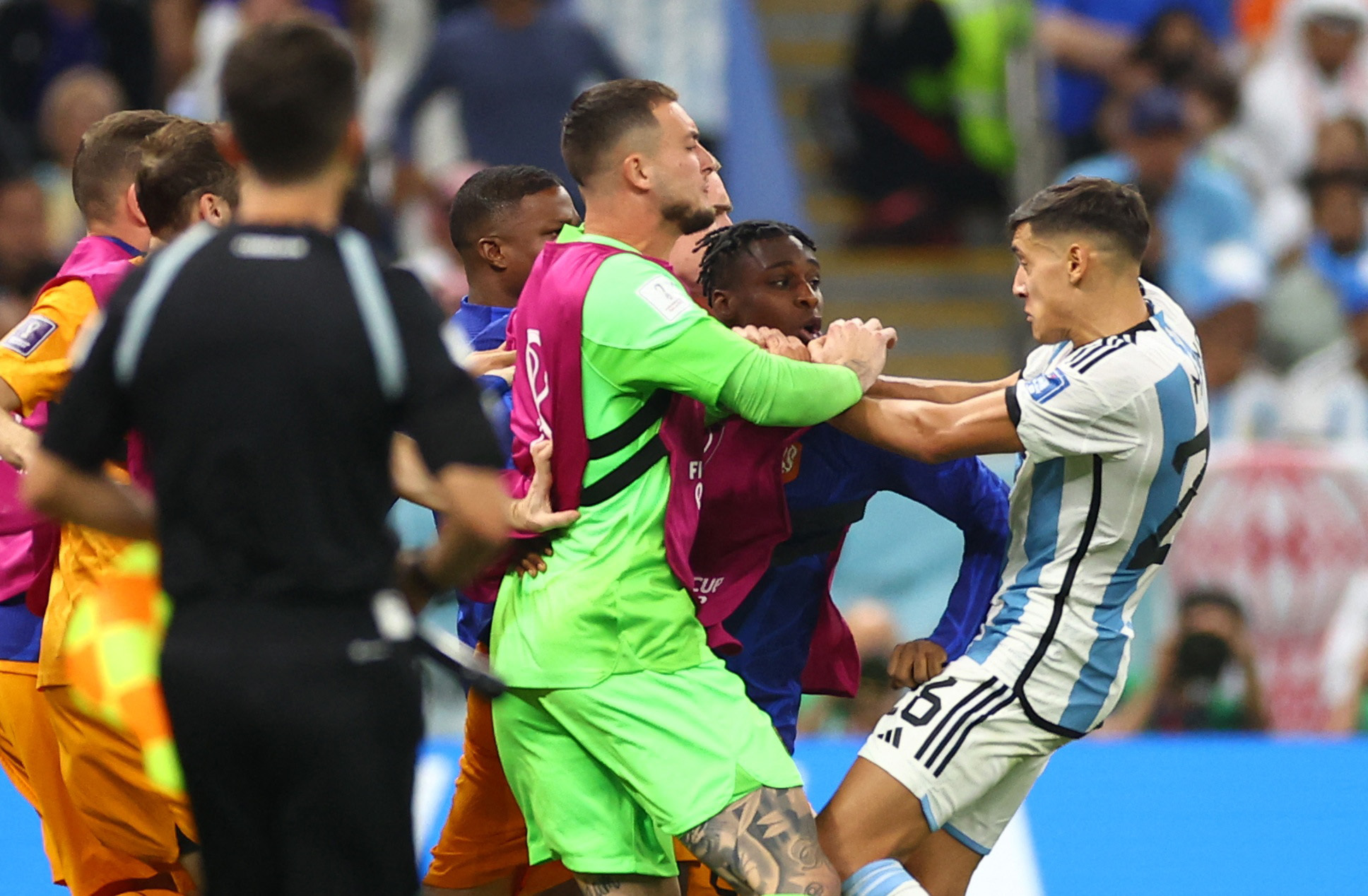 Argentina's Nahuel Molina clashes with the Netherlands players at Lusail Stadium, Lusail, Qatar.