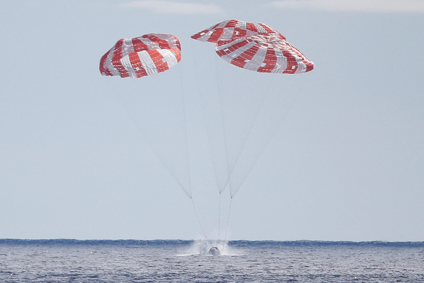 NASA’s Orion capsule splashes down