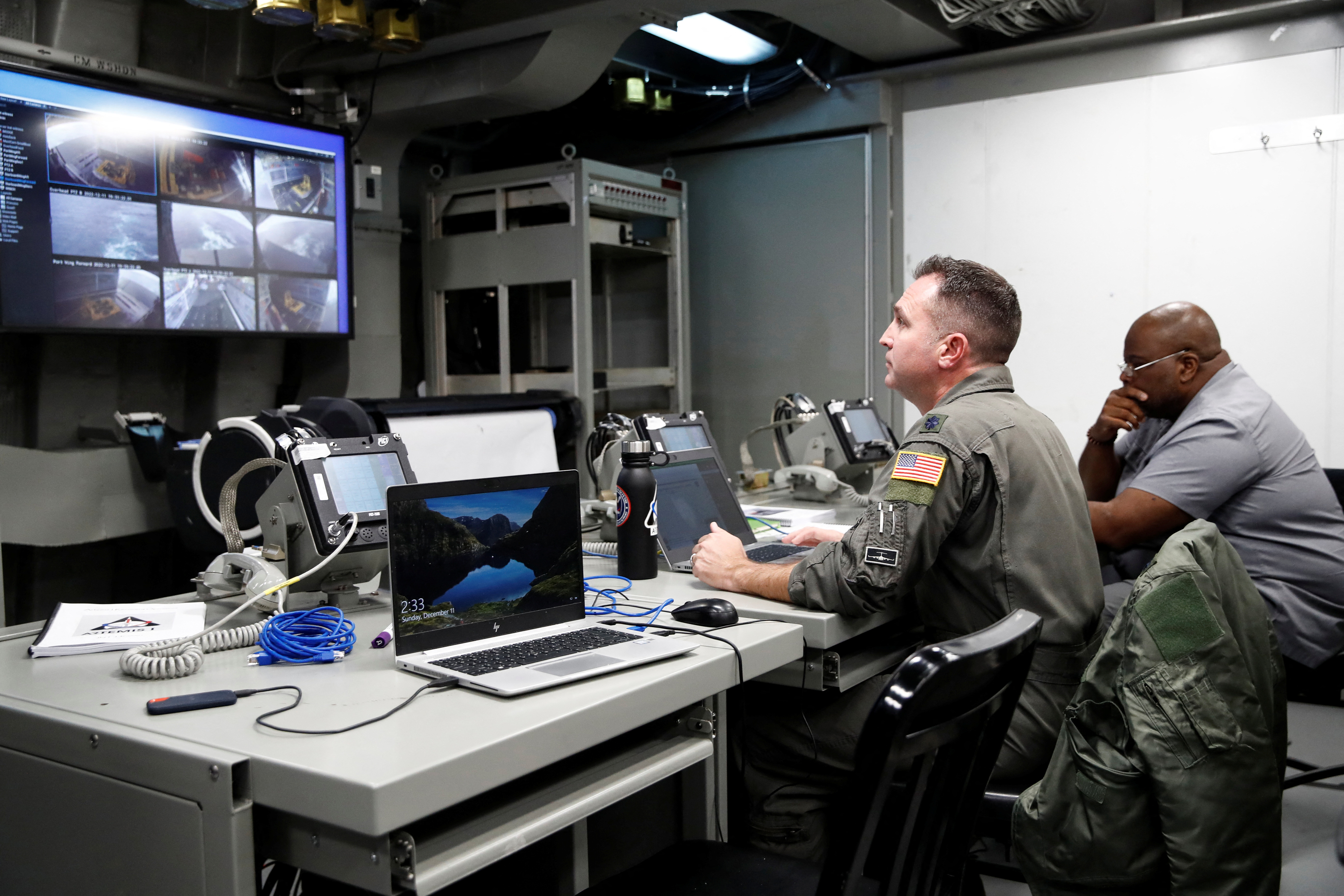 team participate in the official handover from the Orion program to the recovery team as recovery operations for the Orion capsule