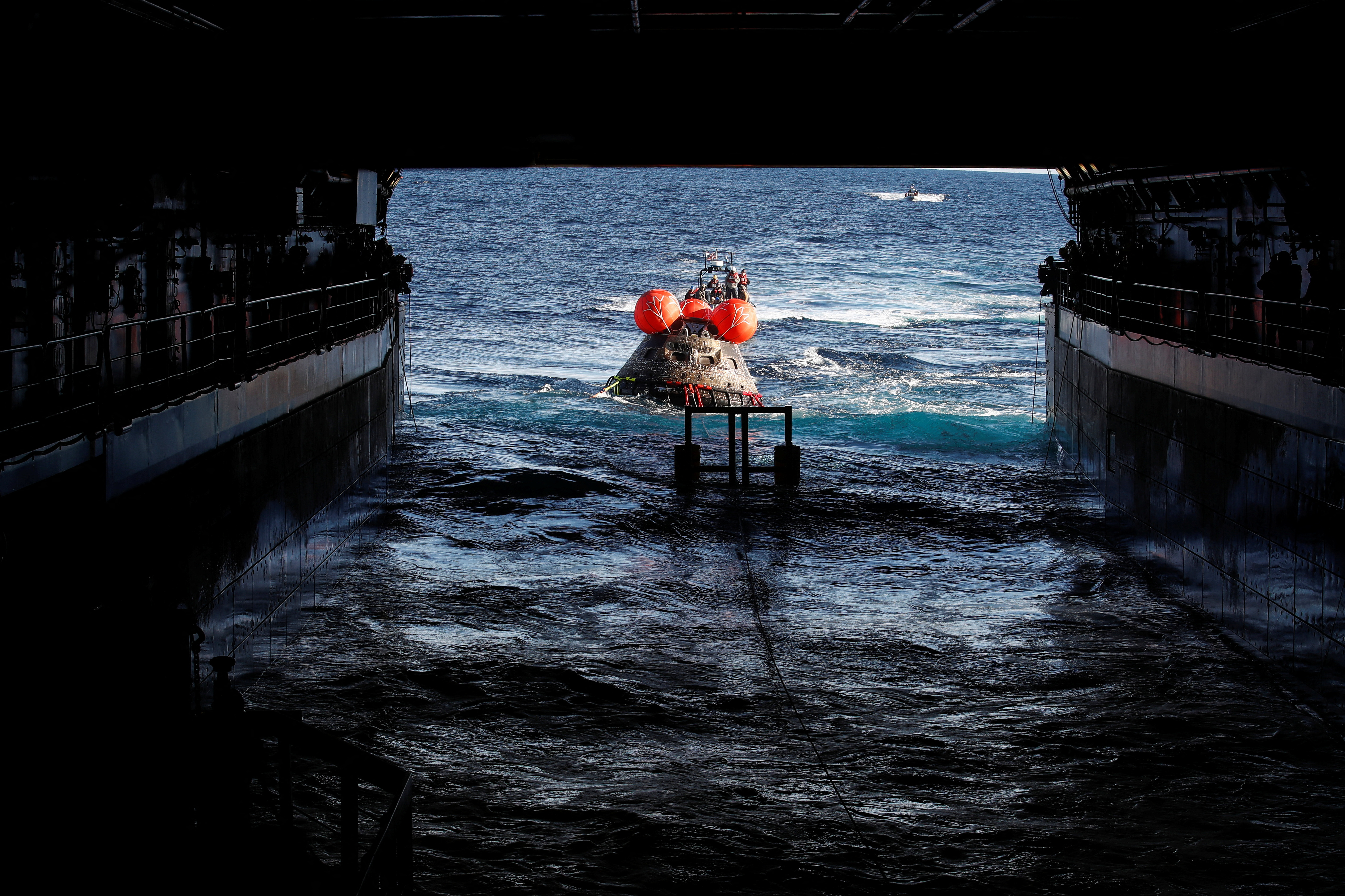 NASA’s Orion capsule makes its way towards the U.S.S. Portland