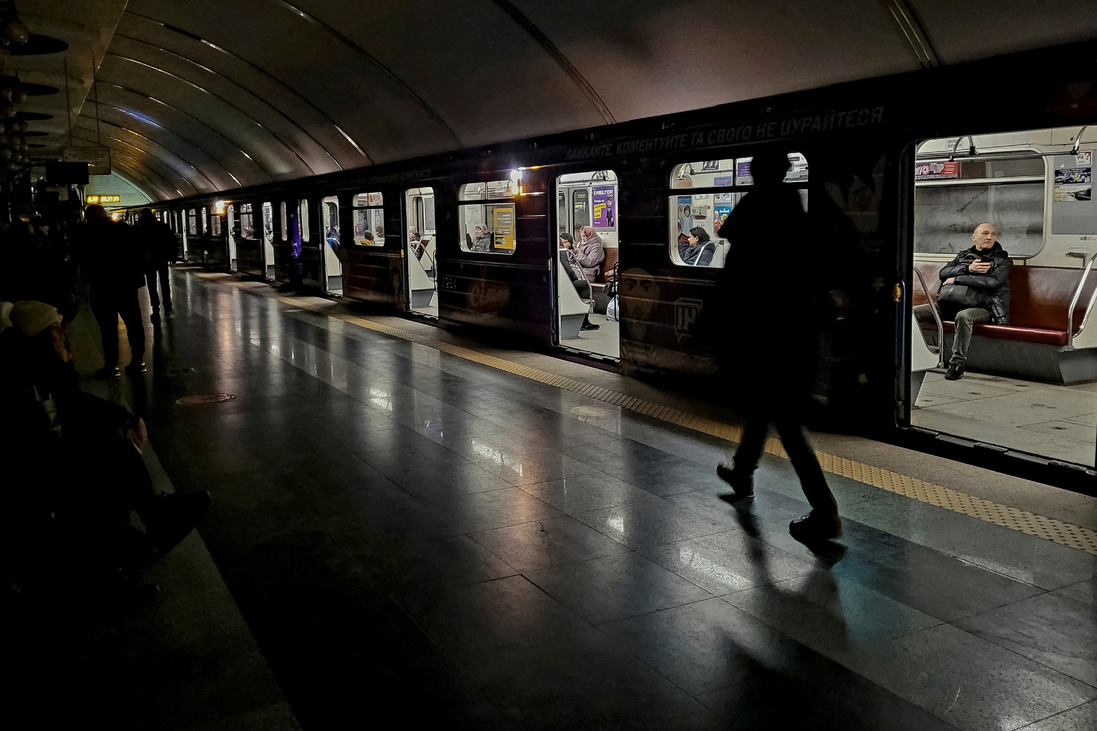People shelter inside a metro station in Ukraine