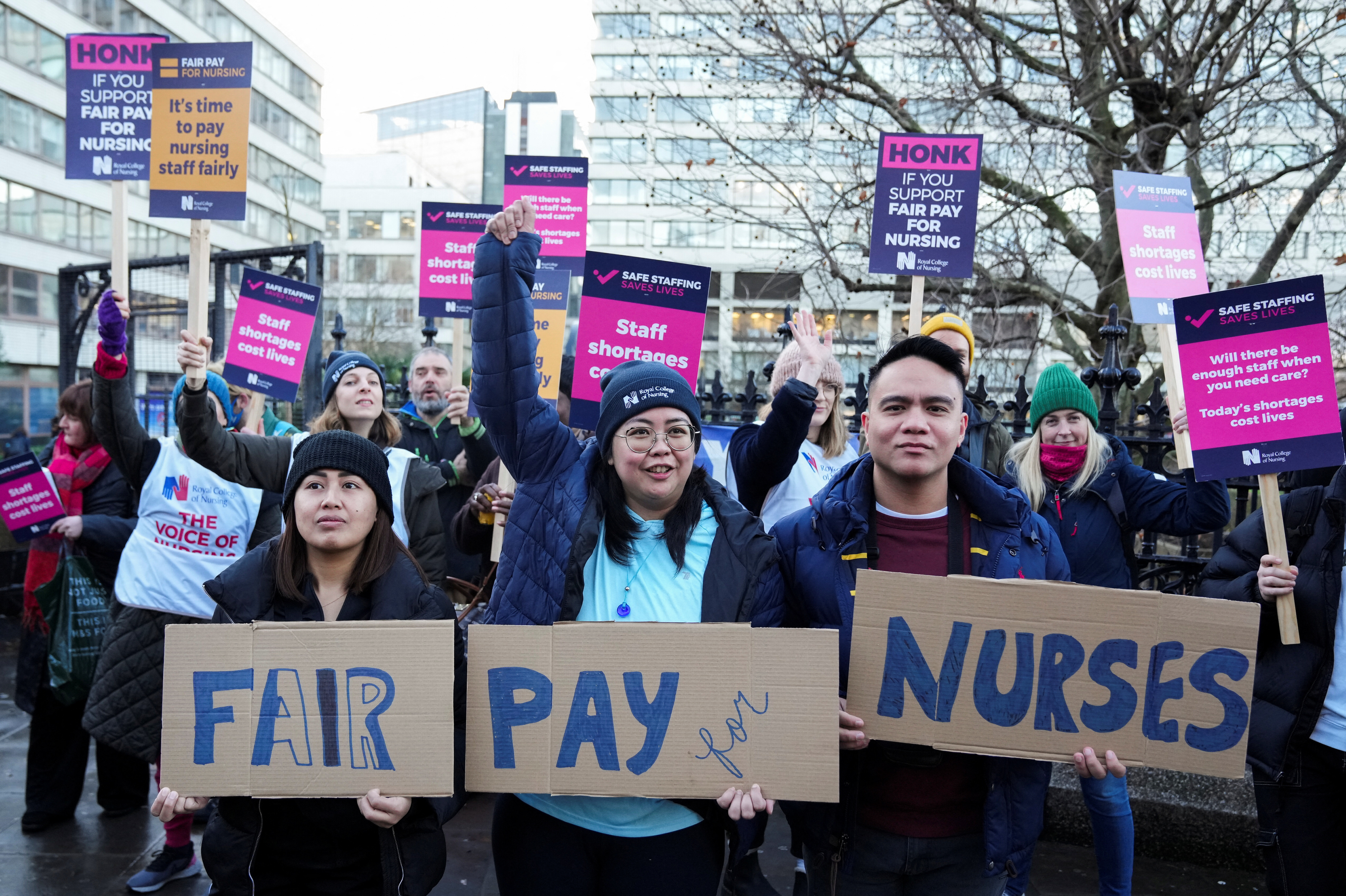 NHS nurses hold placards during a strike