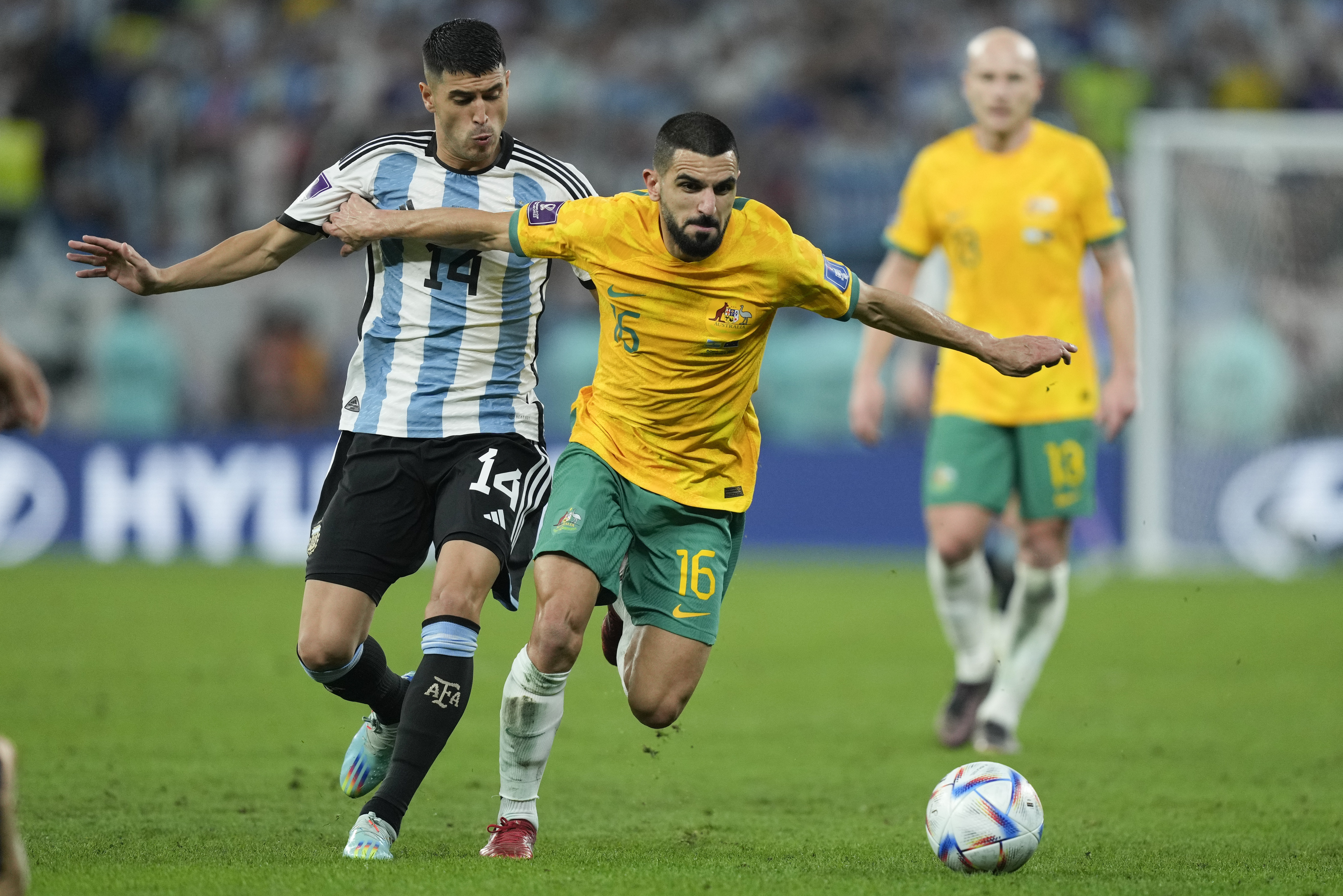 Australia's Aziz Behich and Argentina's Exequiel Palacios battle for the ball during their World Cup Round of 16 football match.