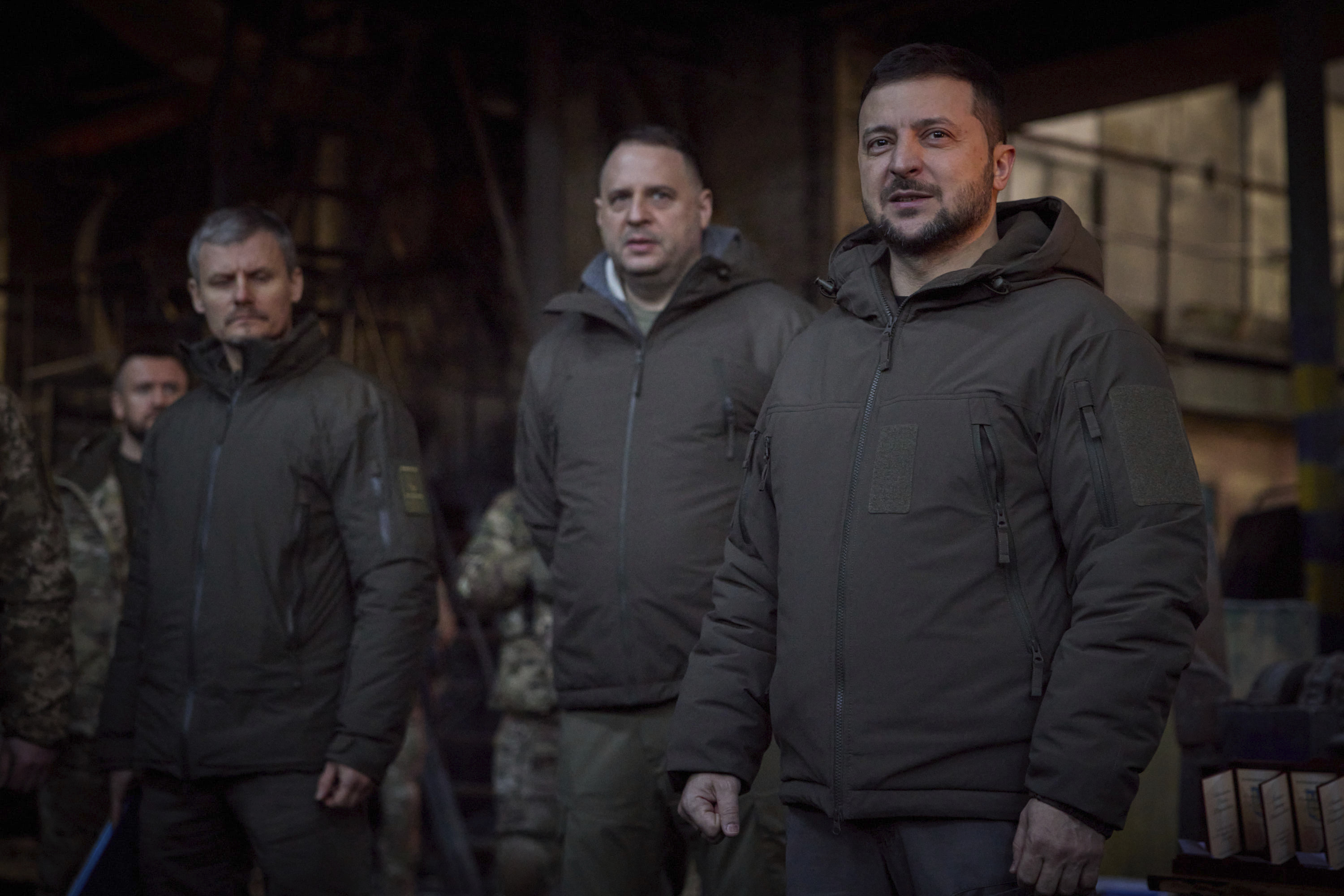 President Volodymyr Zelenskyy, right, speaks to soldiers