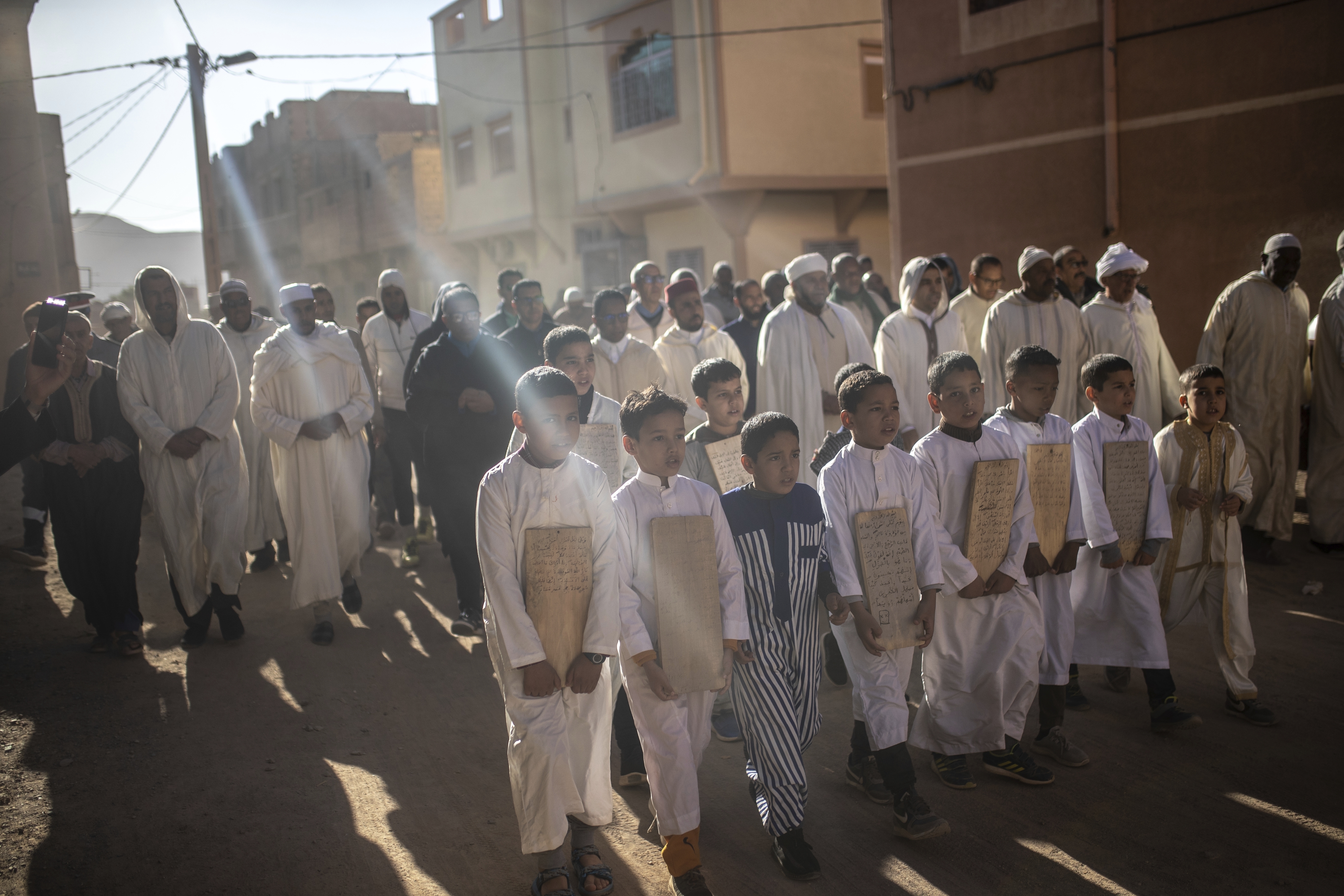 People take part in a rain prayer procession
