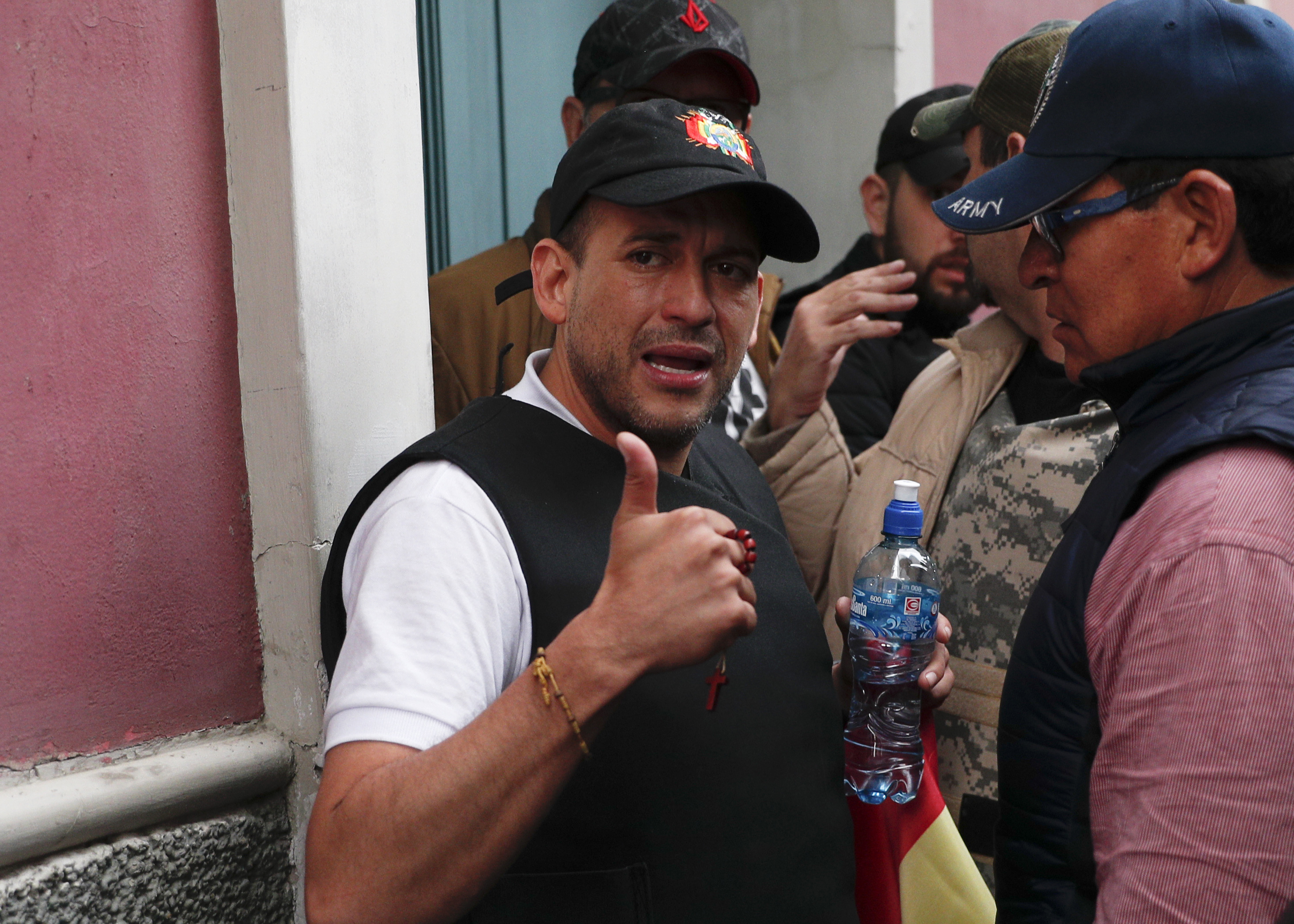Luis Fernando Camacho flashes a thumbs-up in La Paz after Evo Morales announced resignation