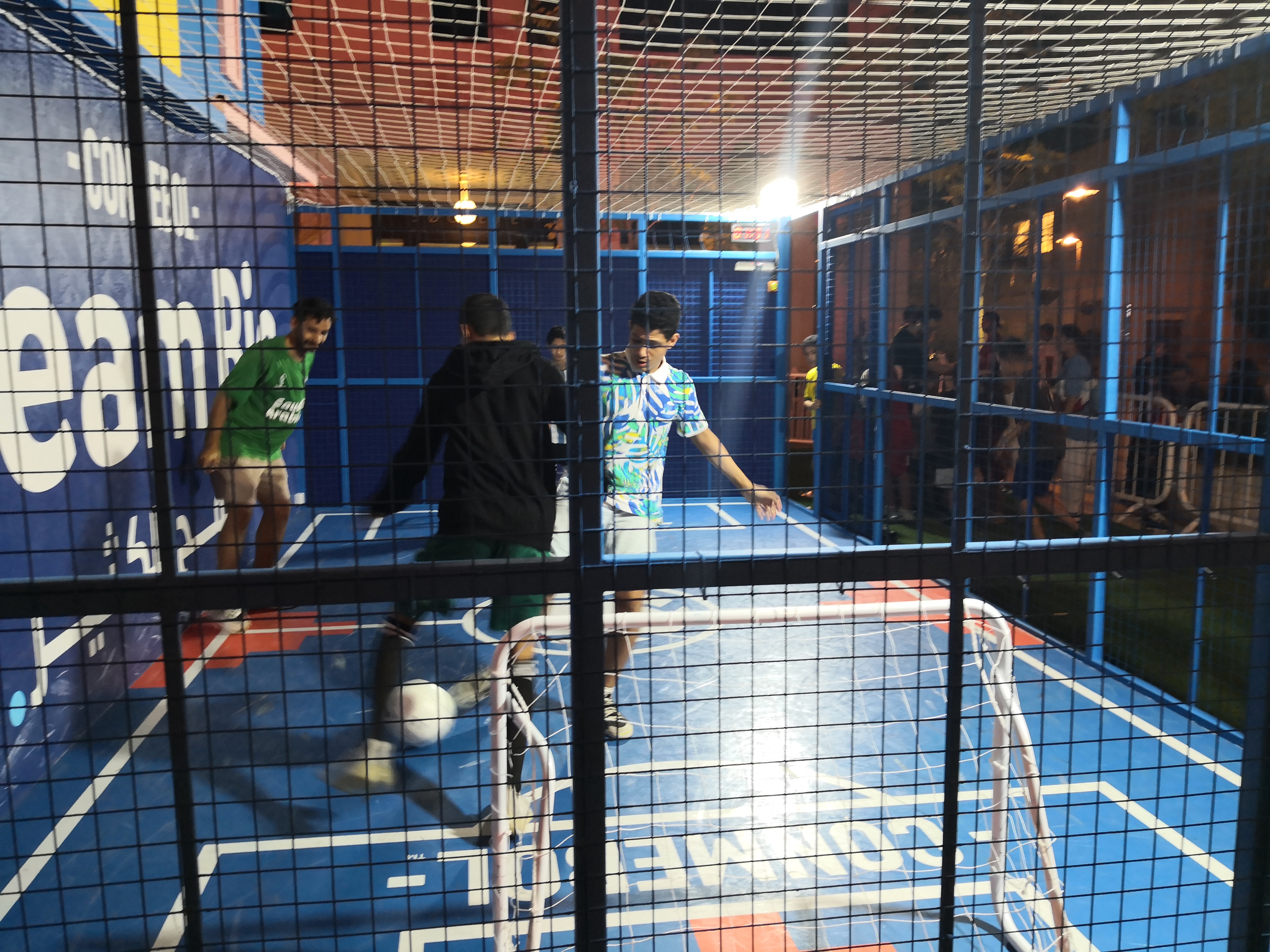Football fans testing their skills against each other at the exhibition of South American football in Doha on November 30, 2022. (Hafsa Adil/Al Jazeera)