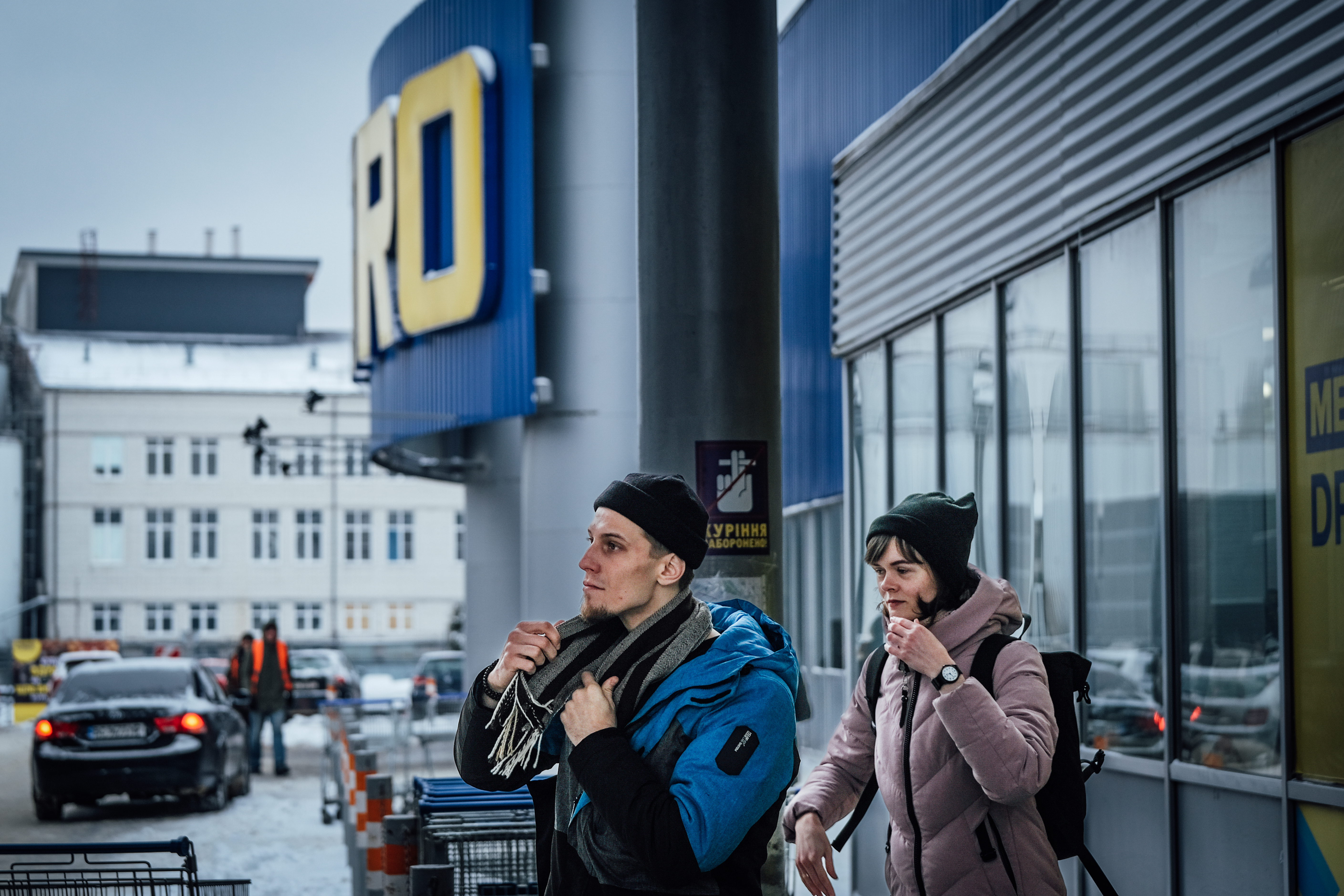 Oleksandr and Iryna outside a supermarket