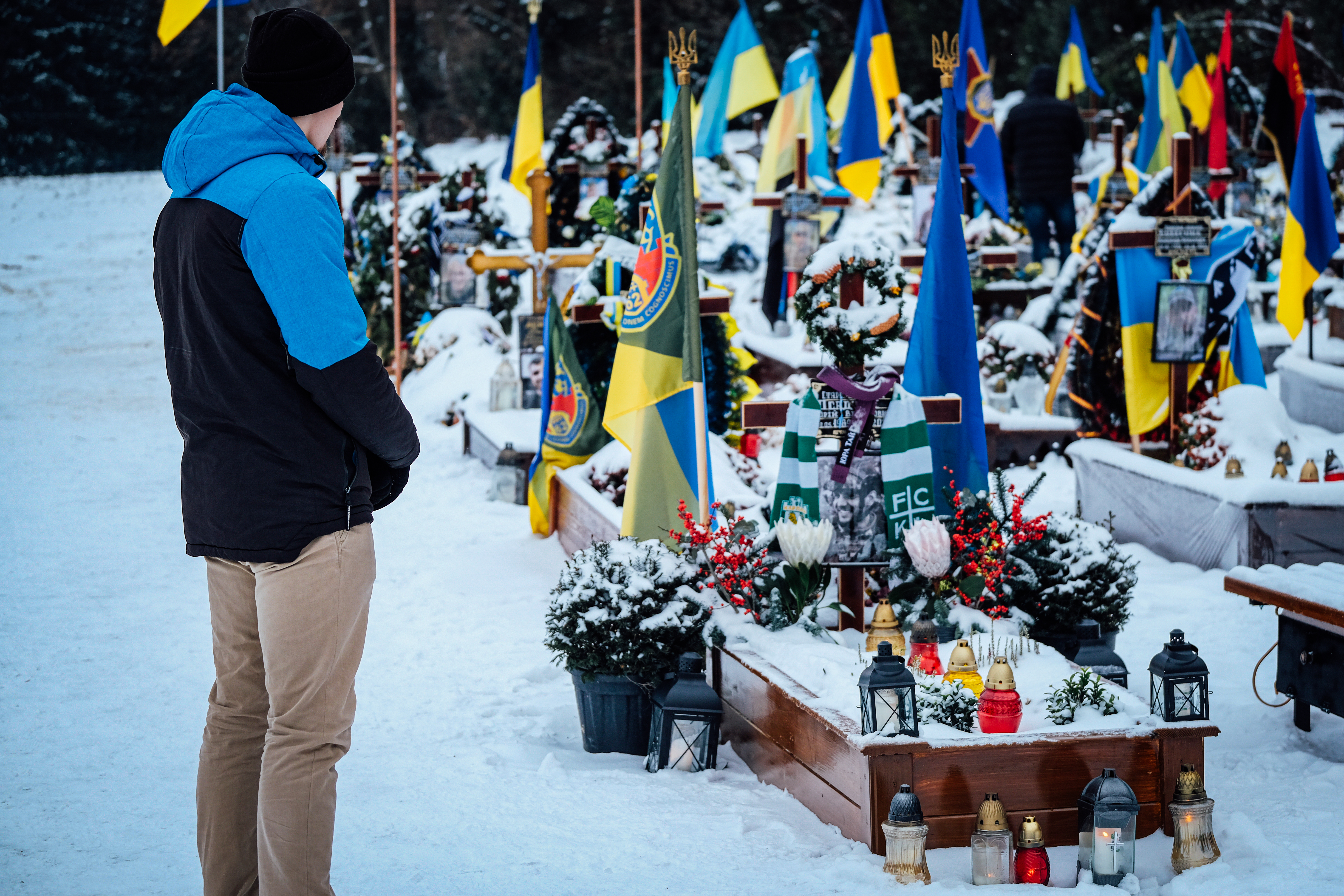 Oleksandr grave of friend: Oleksandr visits the grave of his friend who was killed by a landmine.