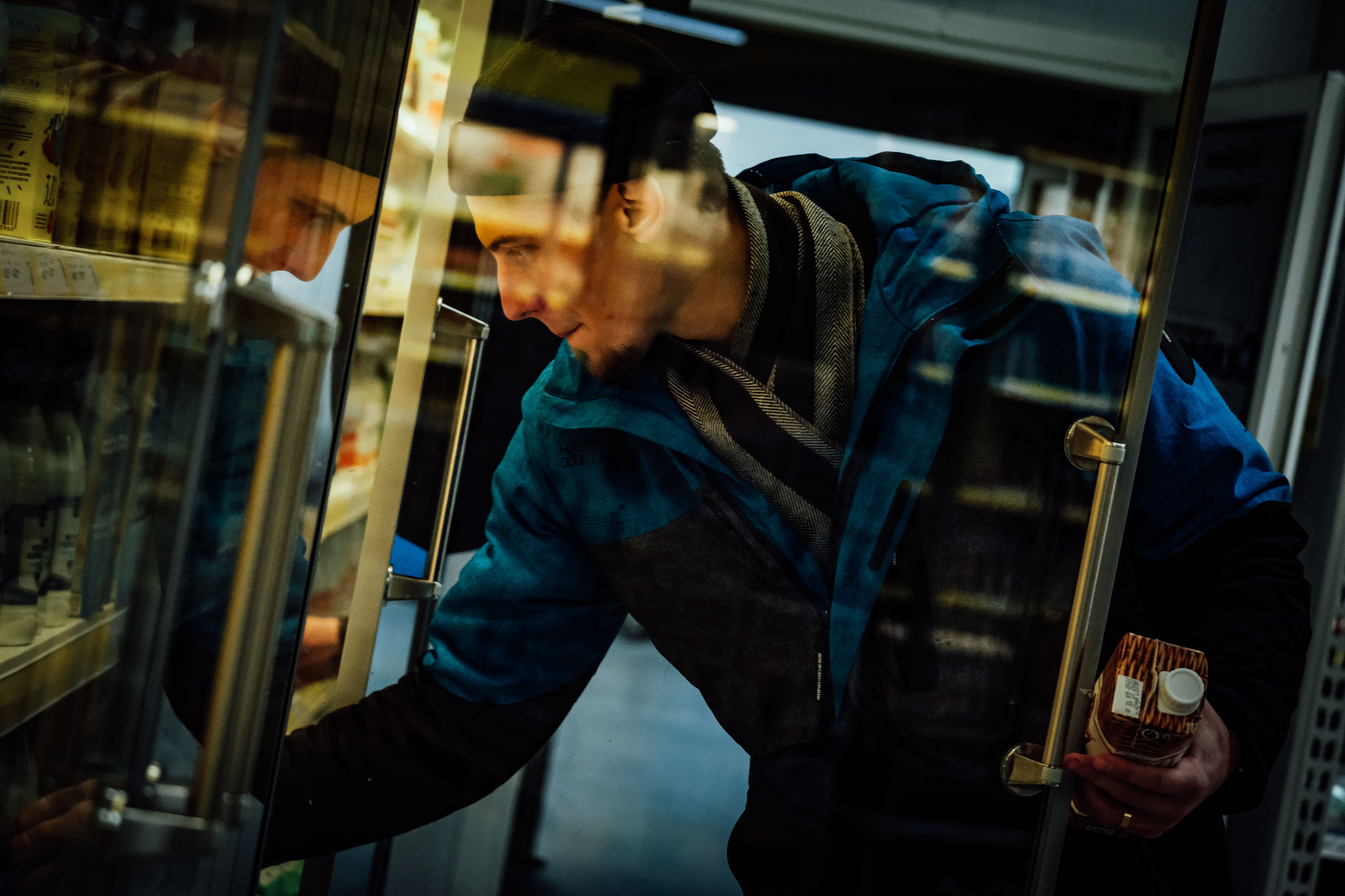 Oleksandr reaches into buy some milk: A 900ml carton has gone costs UAH 35 ($0.67) compared to November 2021, when it cost UAH 25 ($0.94)