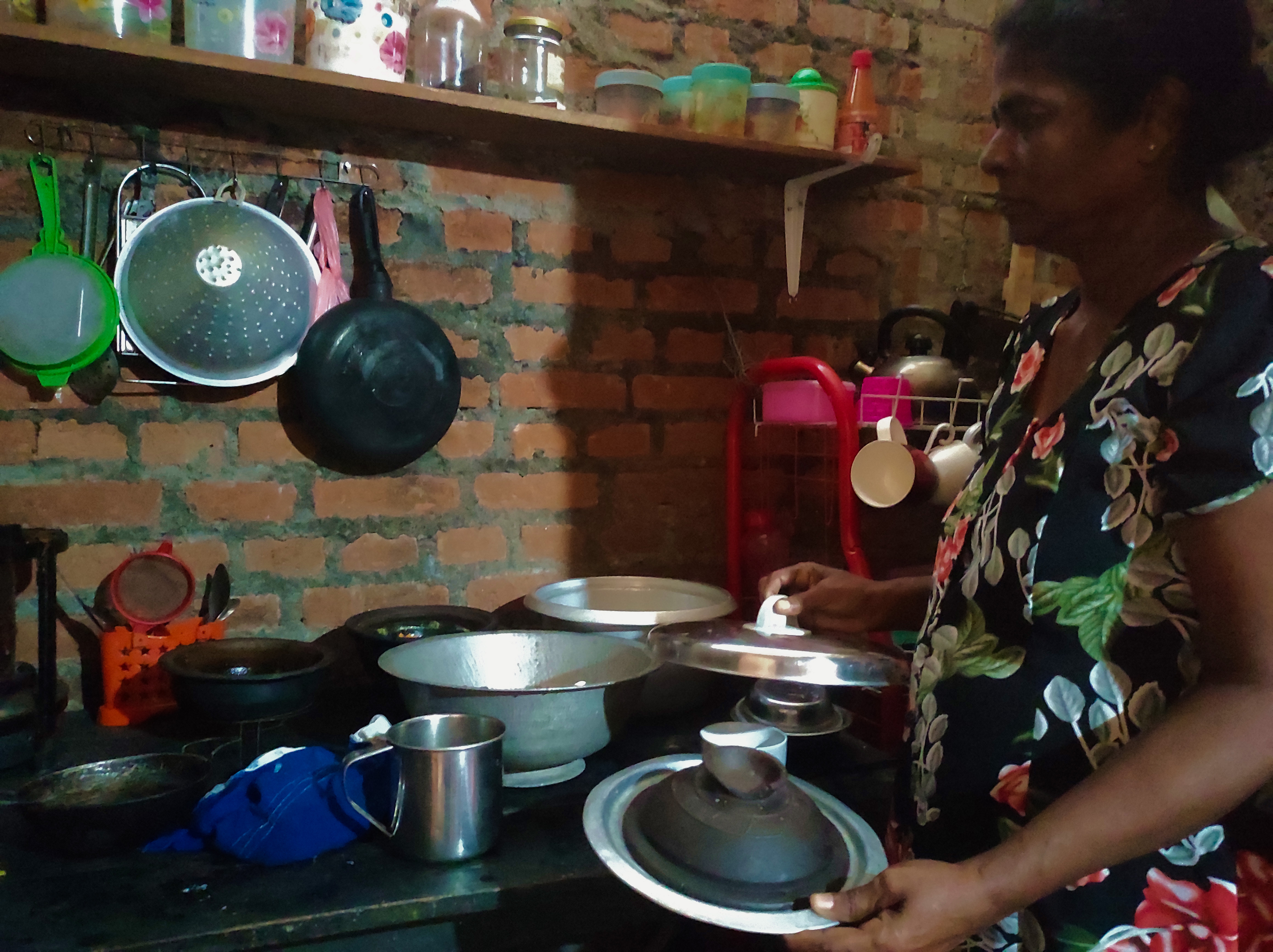 A woman in her kitchen in Sri Lanka