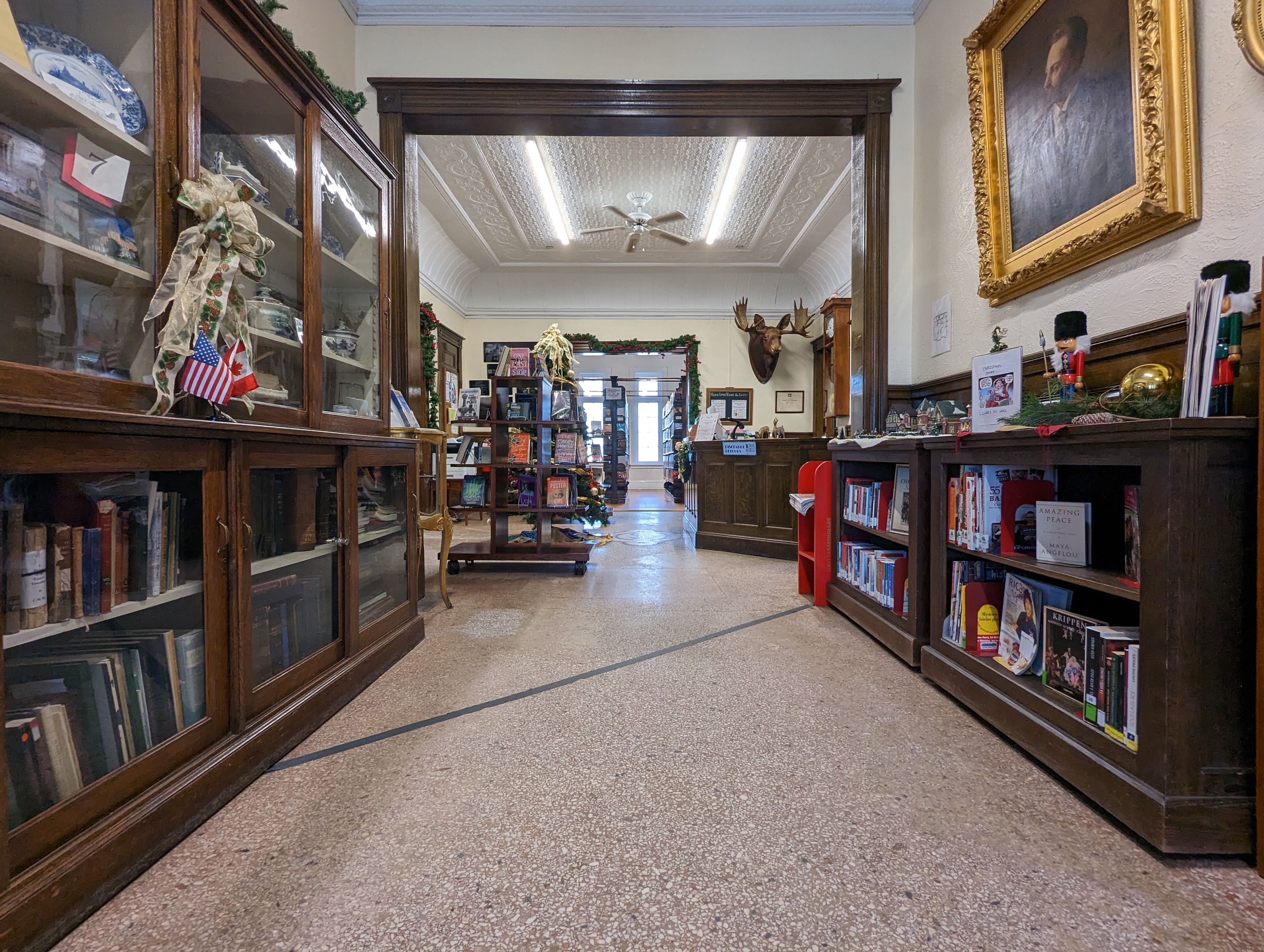 A black line runs across the Haskell Free Library on the US-Canada border