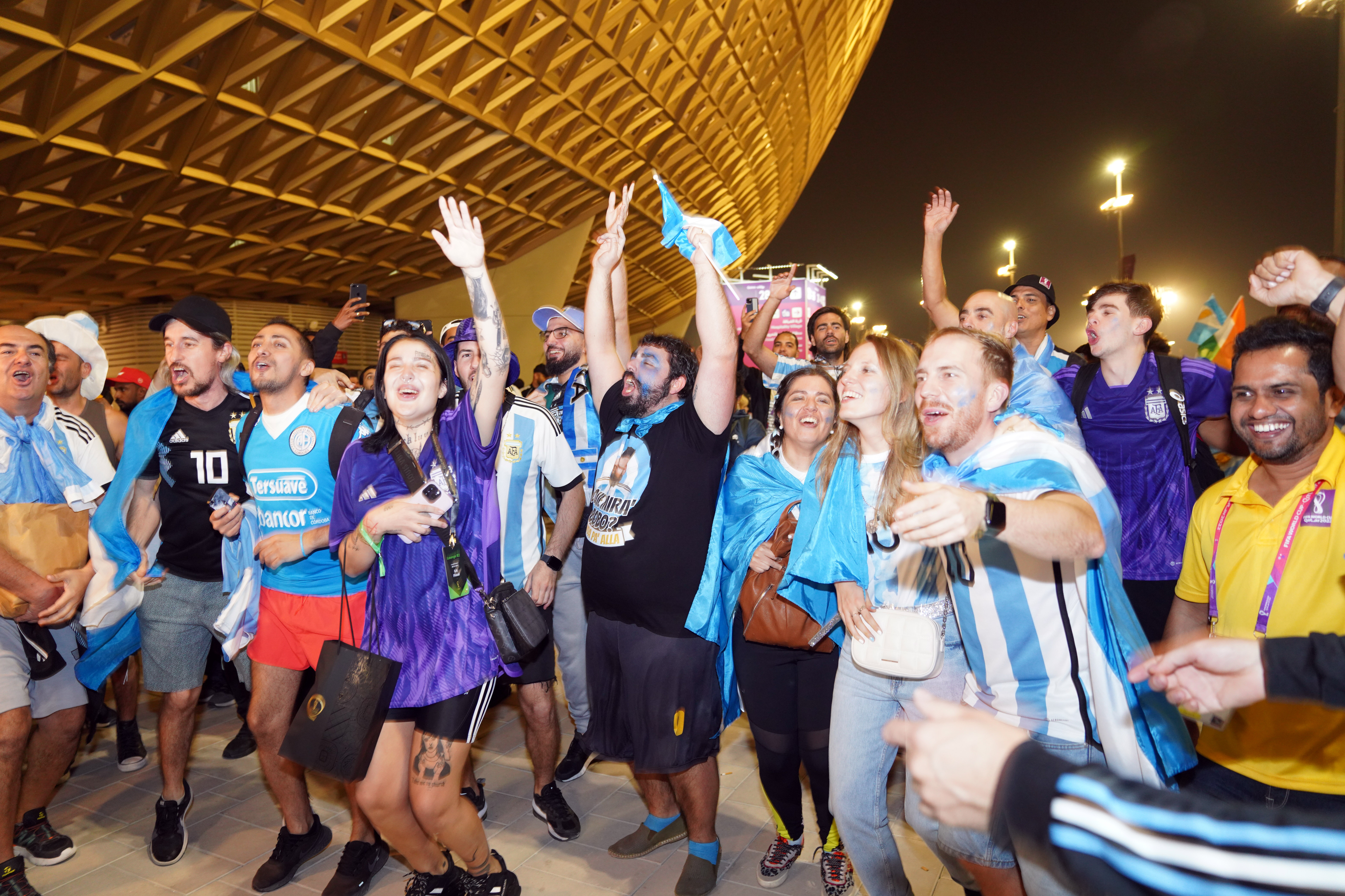 Argentina fans celebrate outside the stadium.