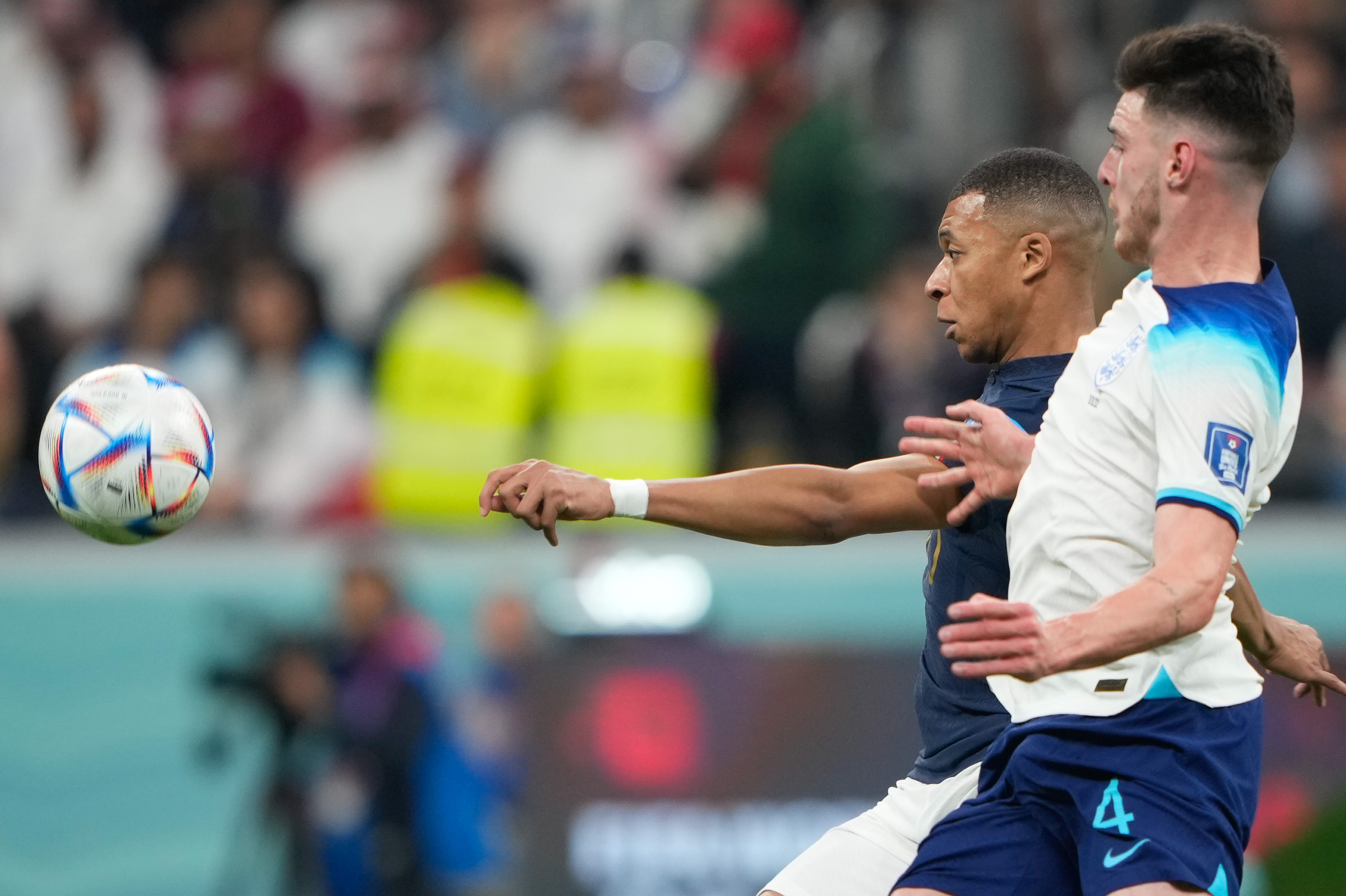 Kylian Mbappe #10 in action with Declan Rice