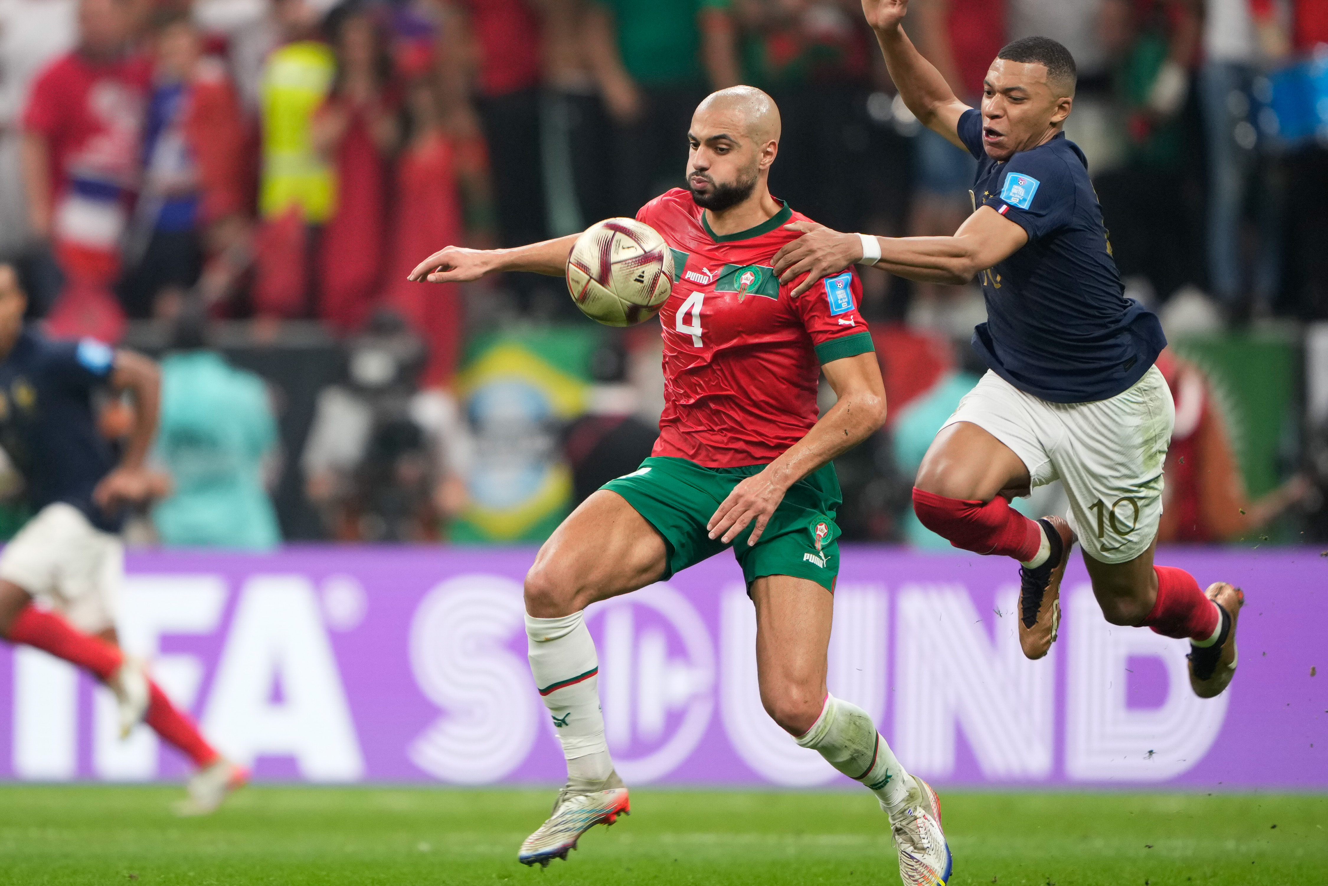 Kylian Mbappe #10 in action with Sofyan Amrabat #4
