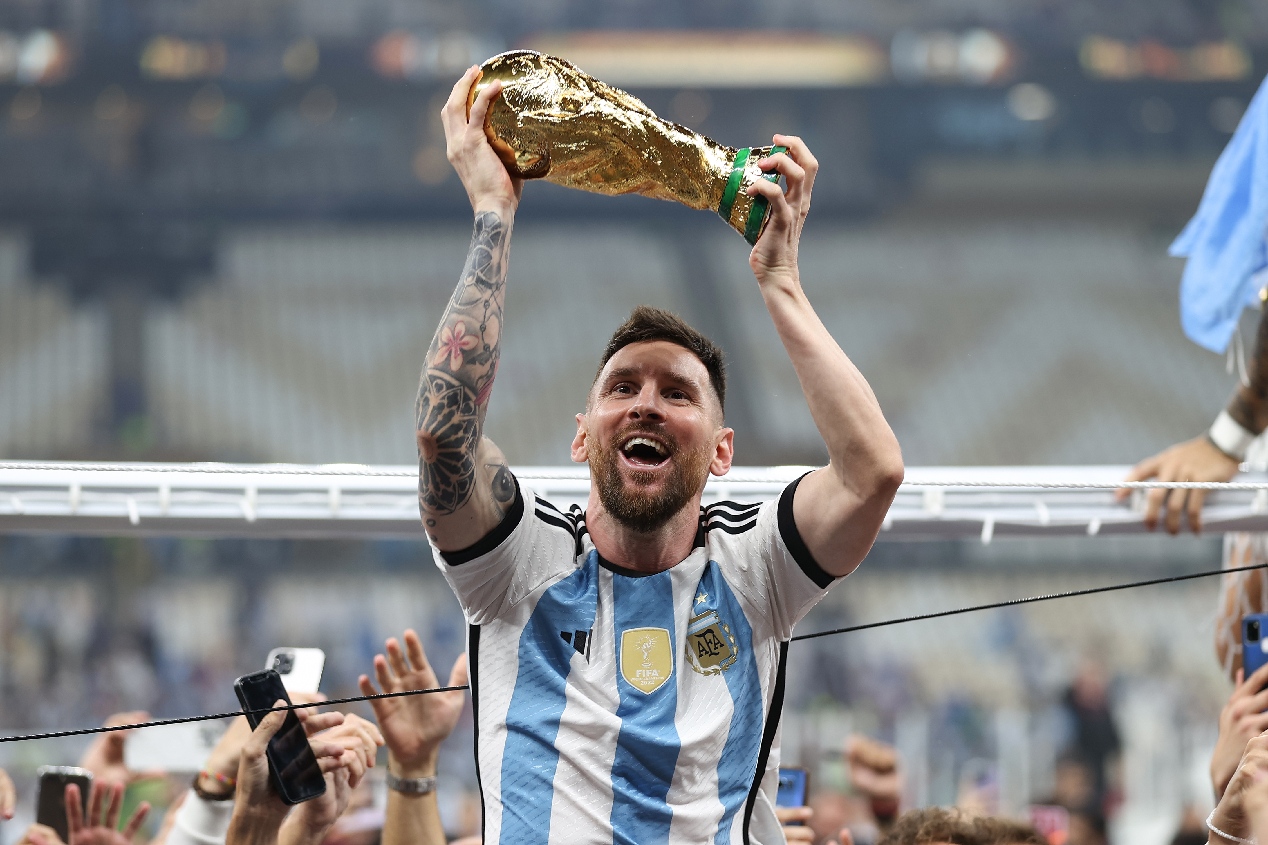 Lionel Messi holds the World Cup aloft after his side's victory over France | Argentina v France
