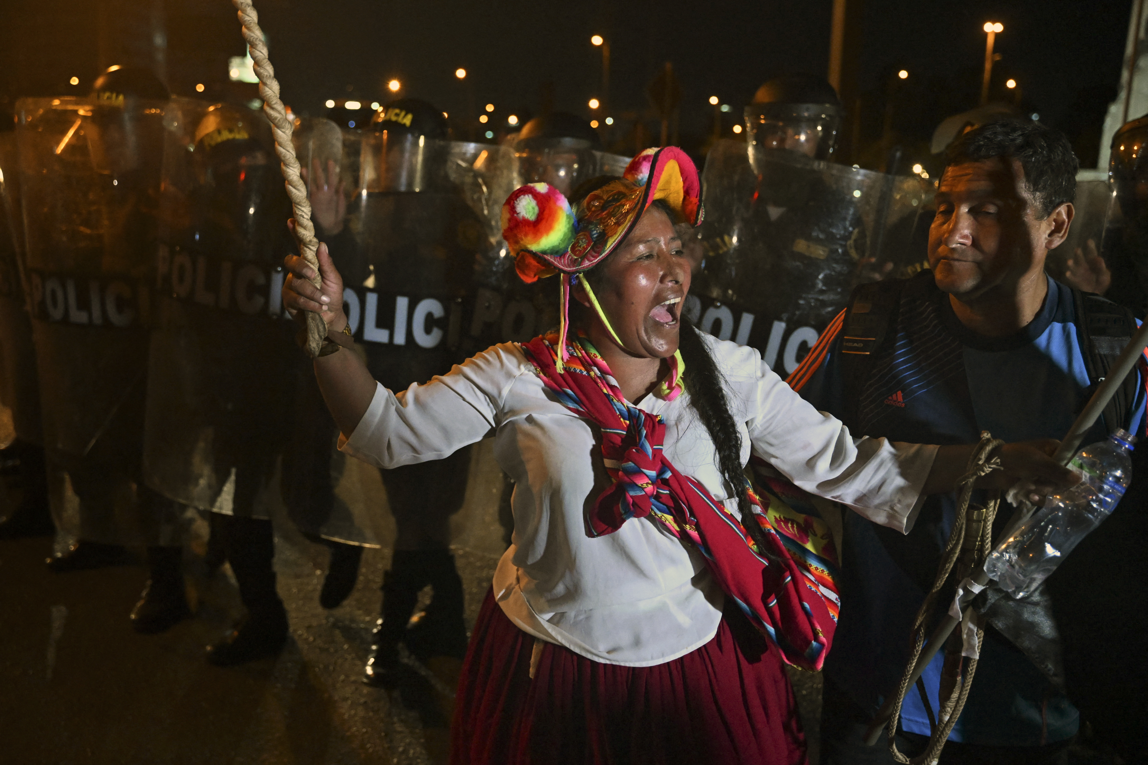 An indigenous woman shouts slogans during a protest demanding the resignation of Peru's President Dina Boluarte in Lima on January 23, 2023.