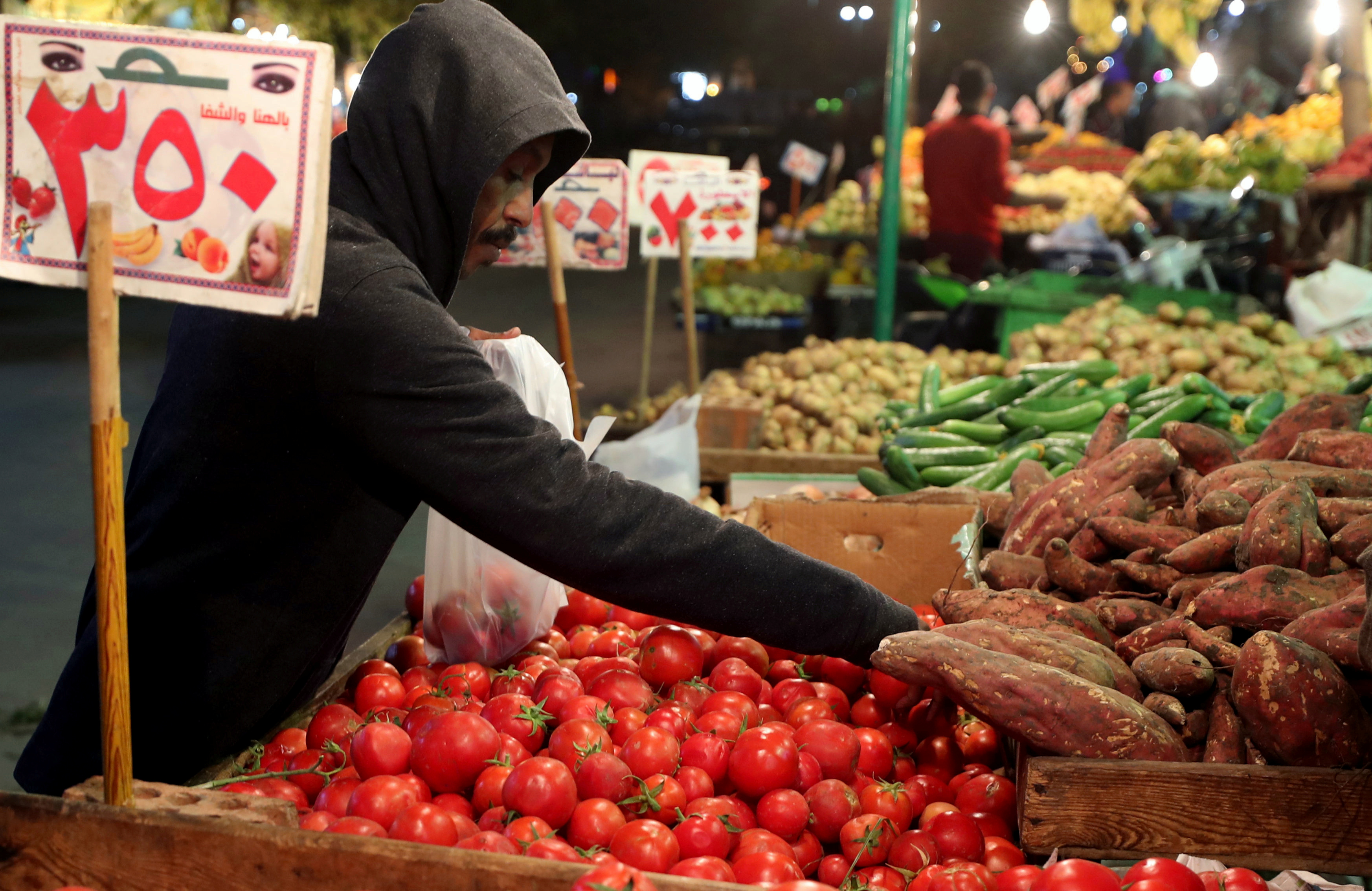 A man shops at a vegetable market in Cairo, Egypt