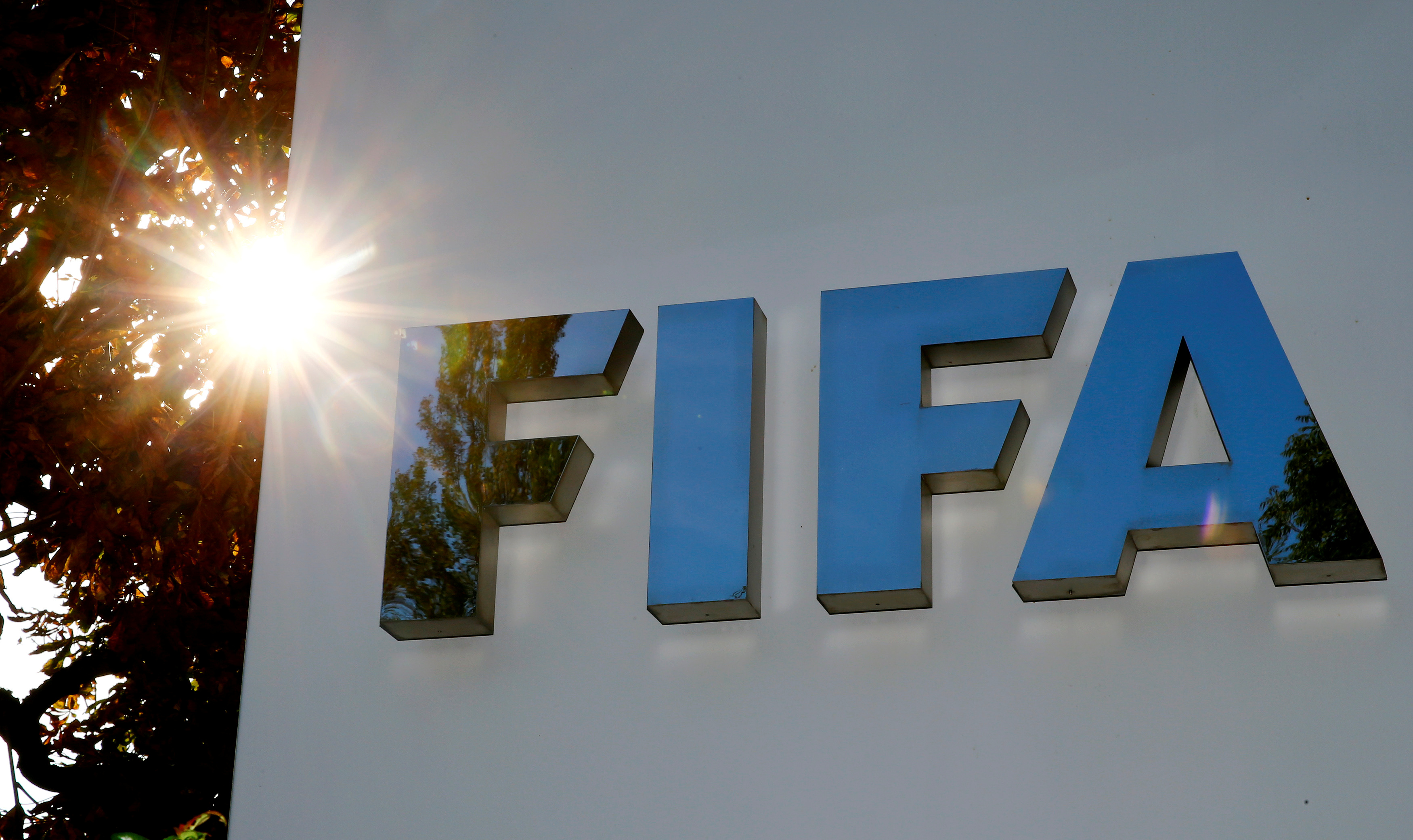 The logo of FIFA on the side of a building