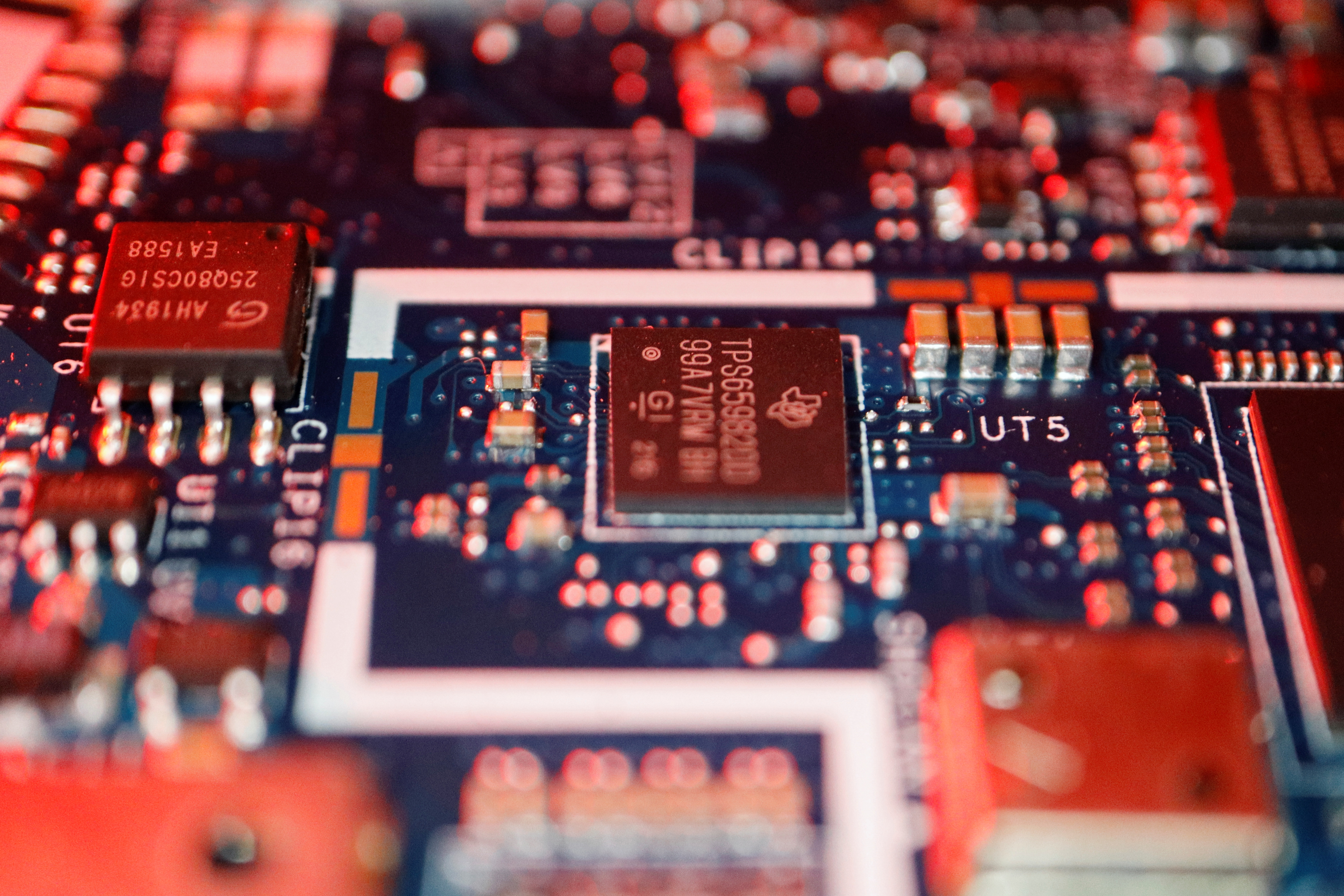 Illustration of semiconductor chips seen on a circuit board of a computer.