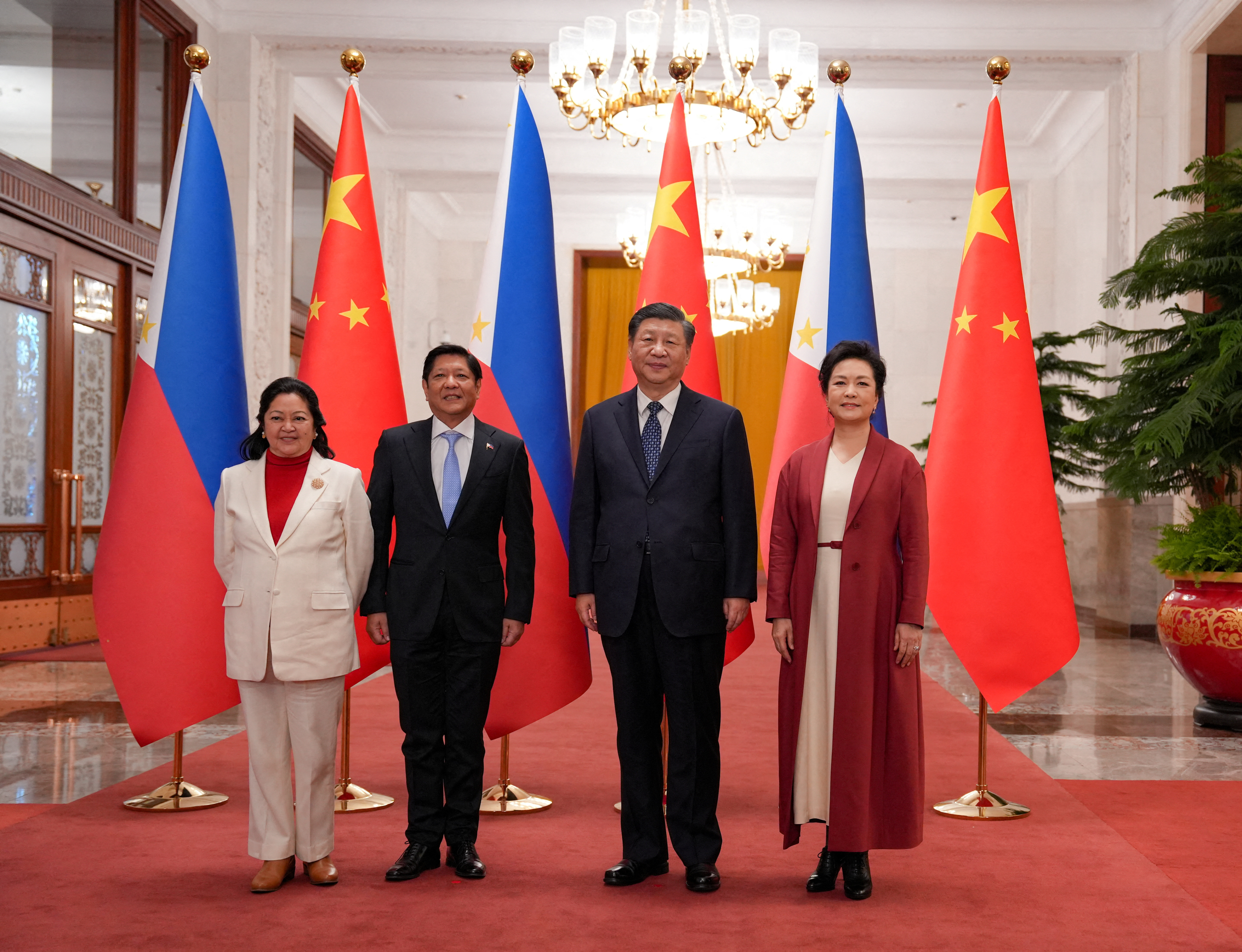 Philippines' President Ferdinand "Bongbong" Marcos Jr and First Lady Liza Araneta Marcos are photographed with China President Xi Jinping and his wife Peng Li Yuan during a welcoming ceremony at the Great Hall of the People in Beijing, China.