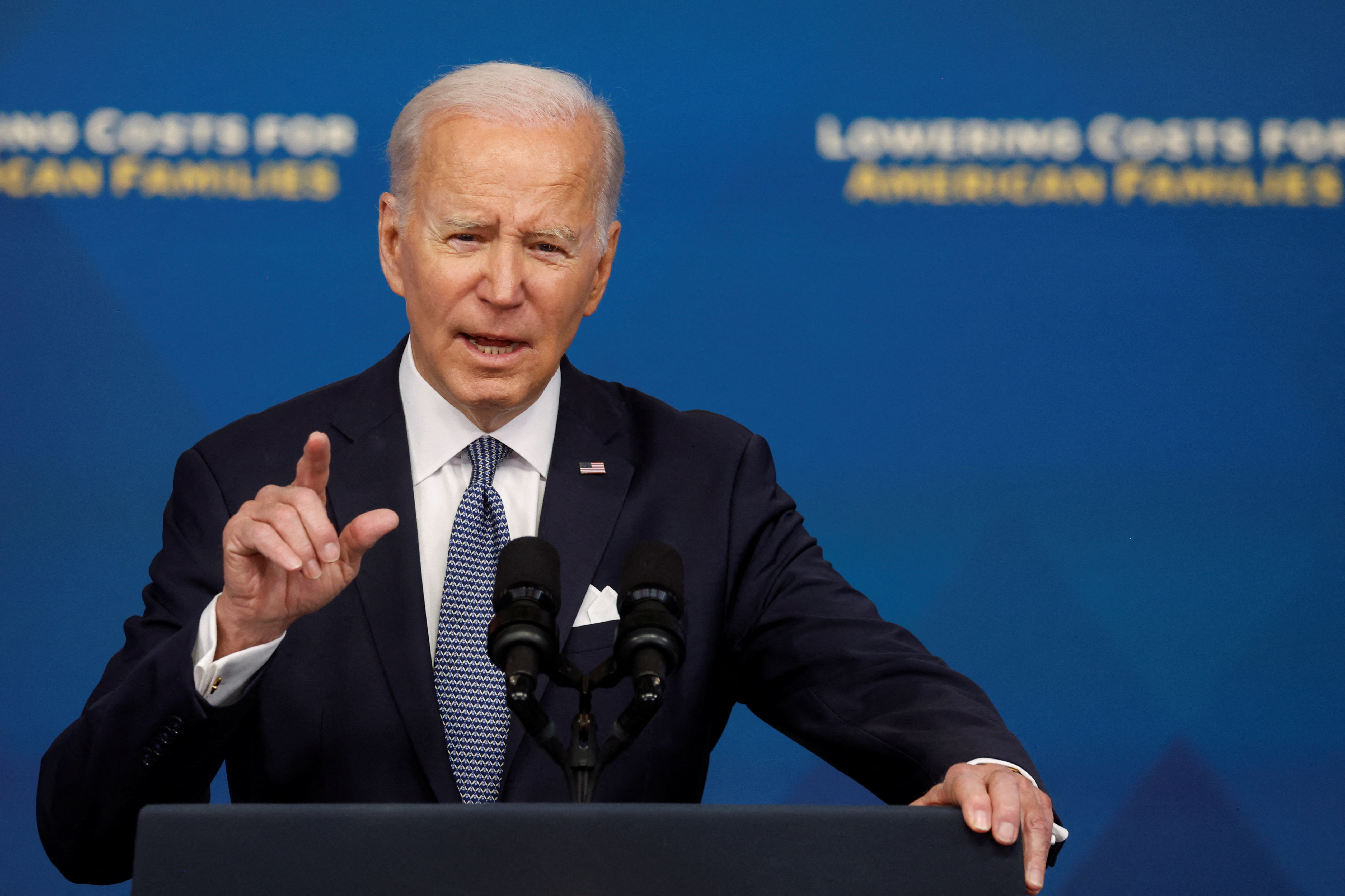US President Joe Biden speaks at a podium
