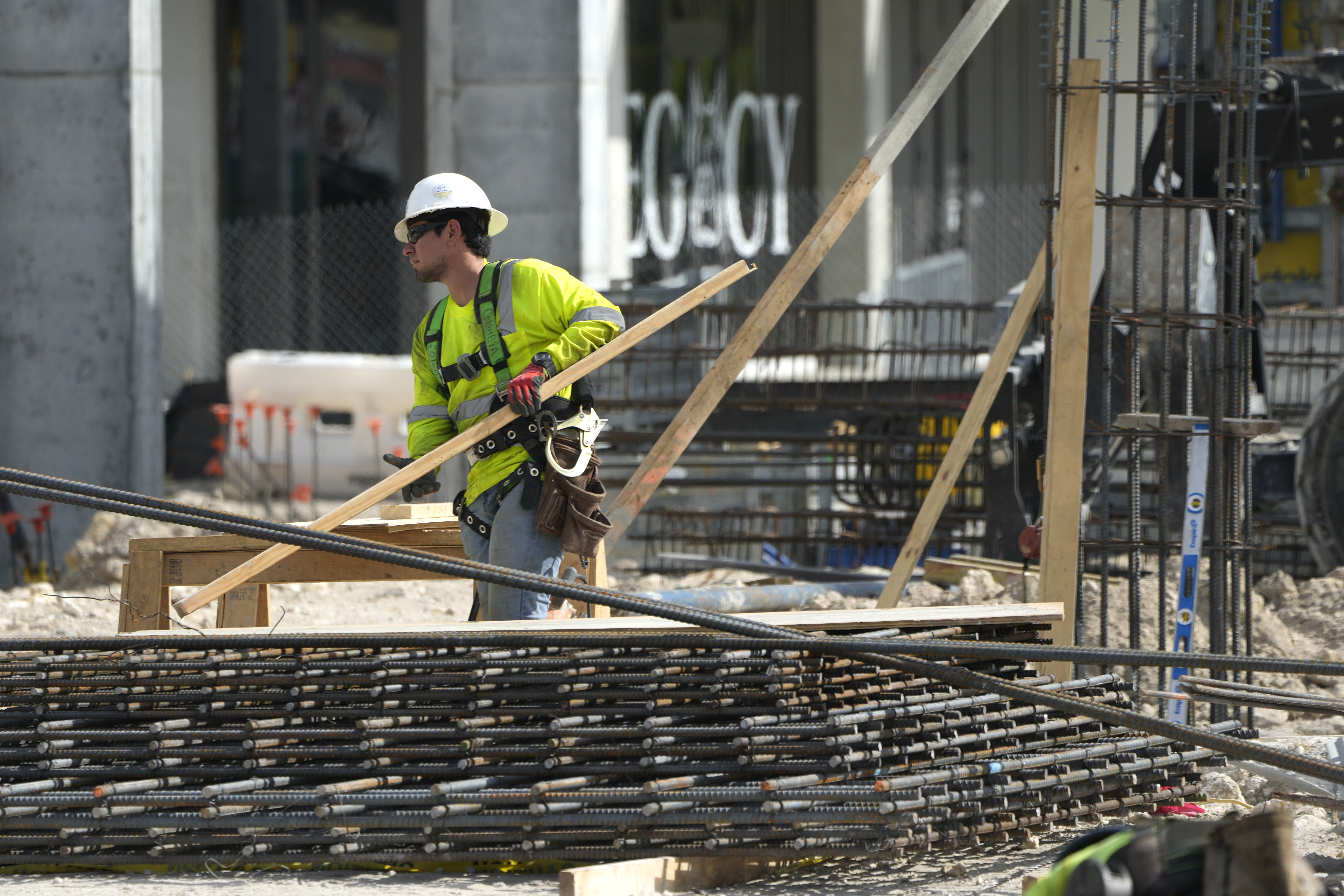 People work at a construction site, in Miami, Florida, US