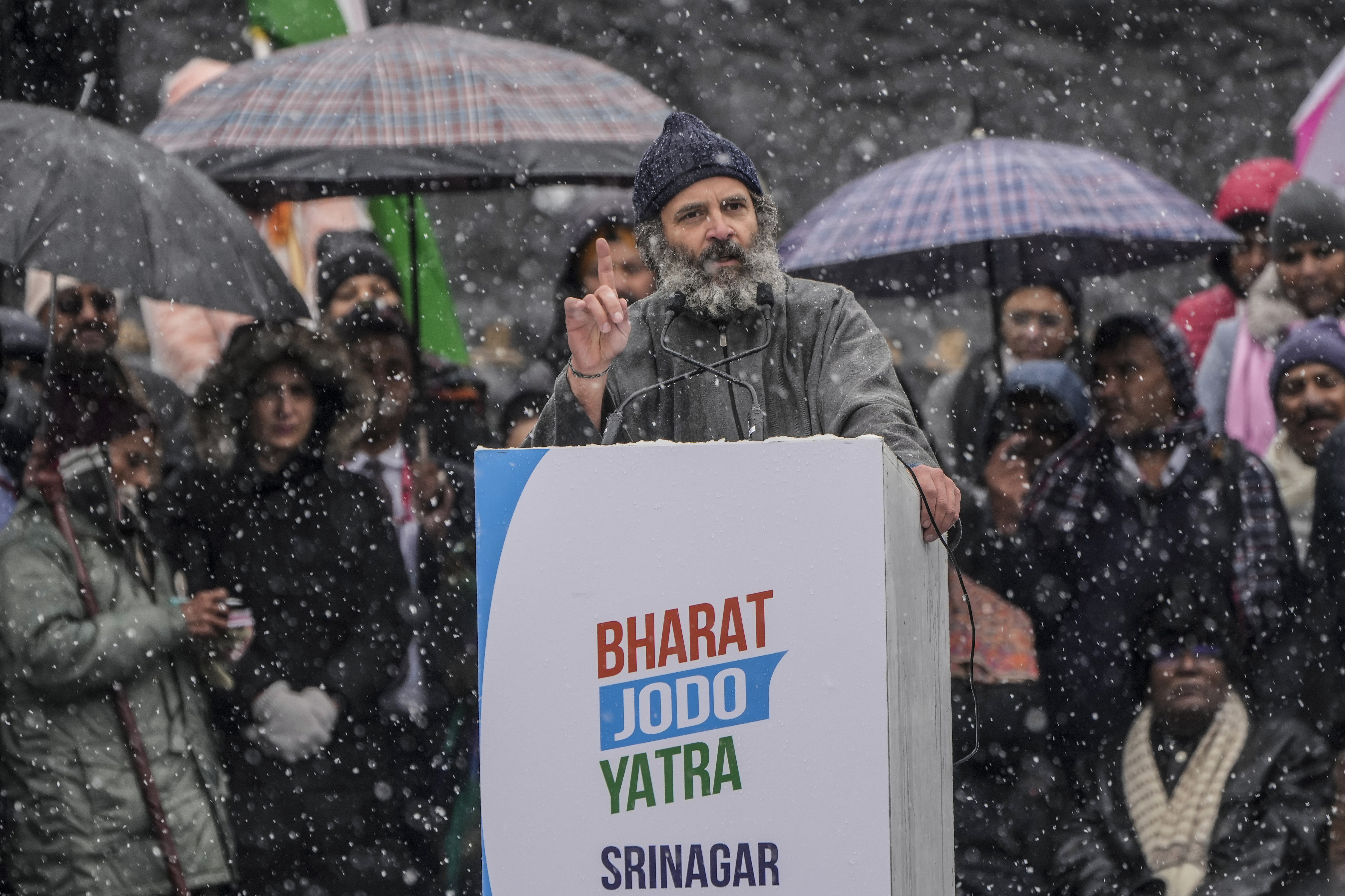 India's opposition Congress party leader Rahul Gandhi, speaks at a public rally as it snows in Srinagar