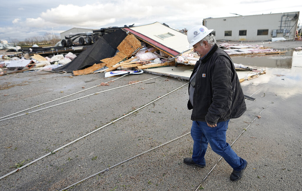 A man surveys the damage from a tornado in Texas.
