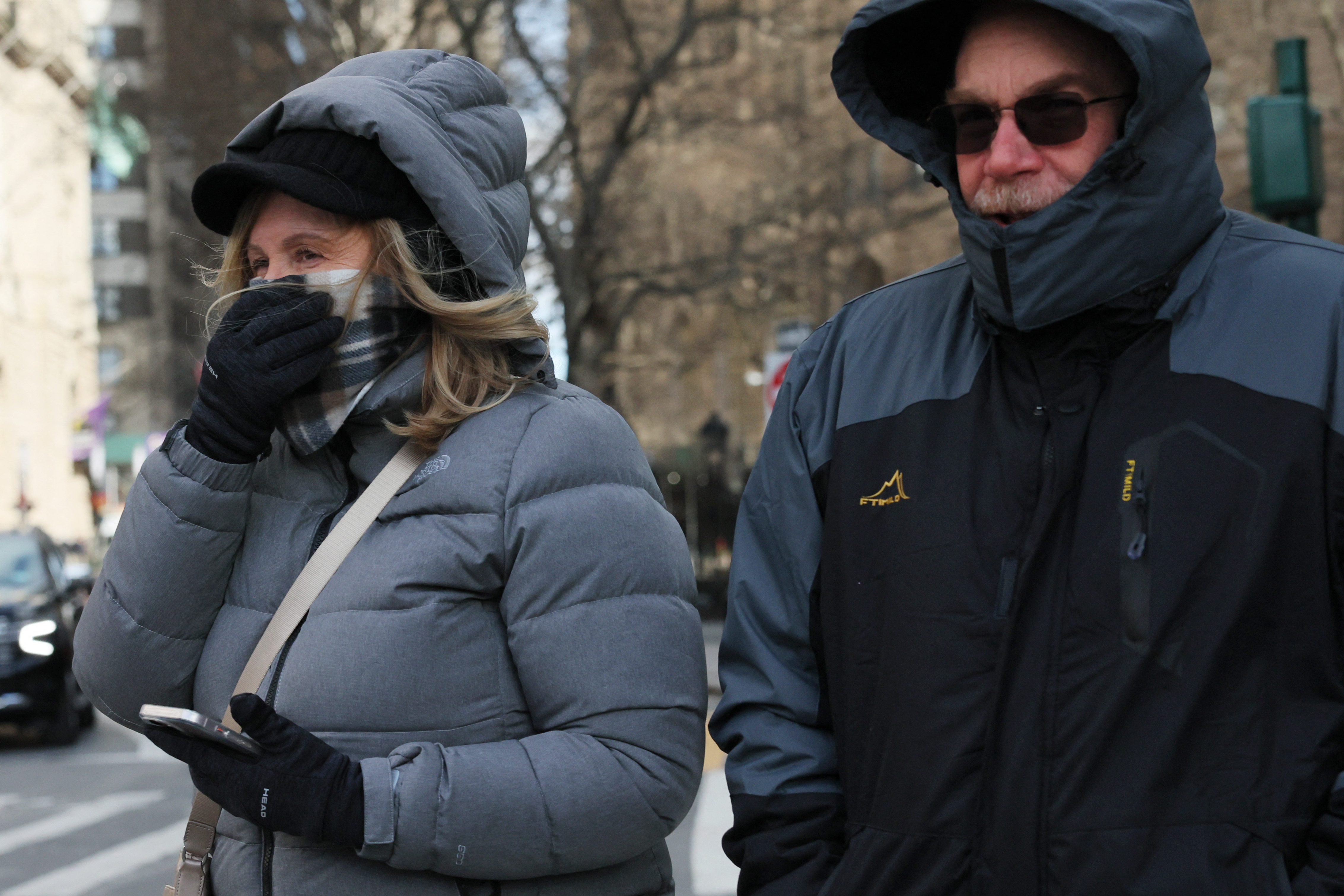People bundle up in New York City as temperatures dip.