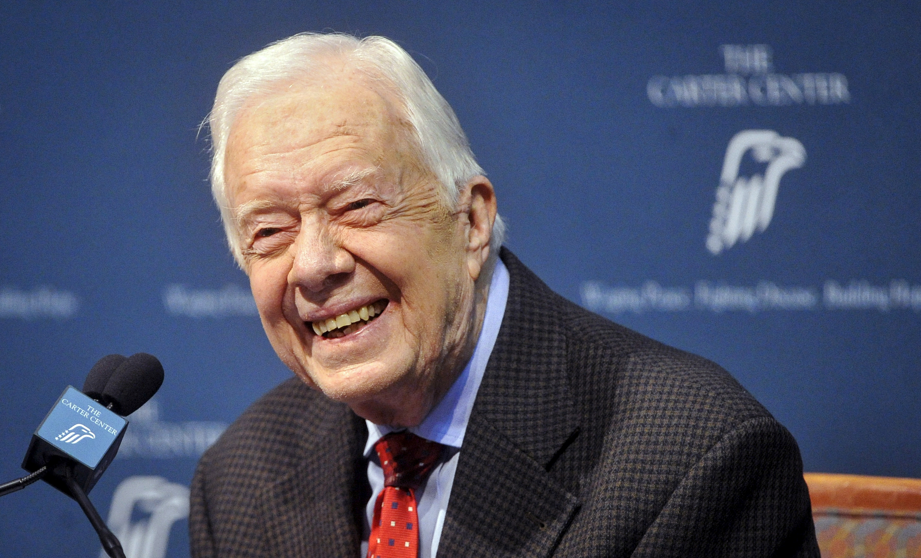 Former President Jimmy Carter answers questions at a media event