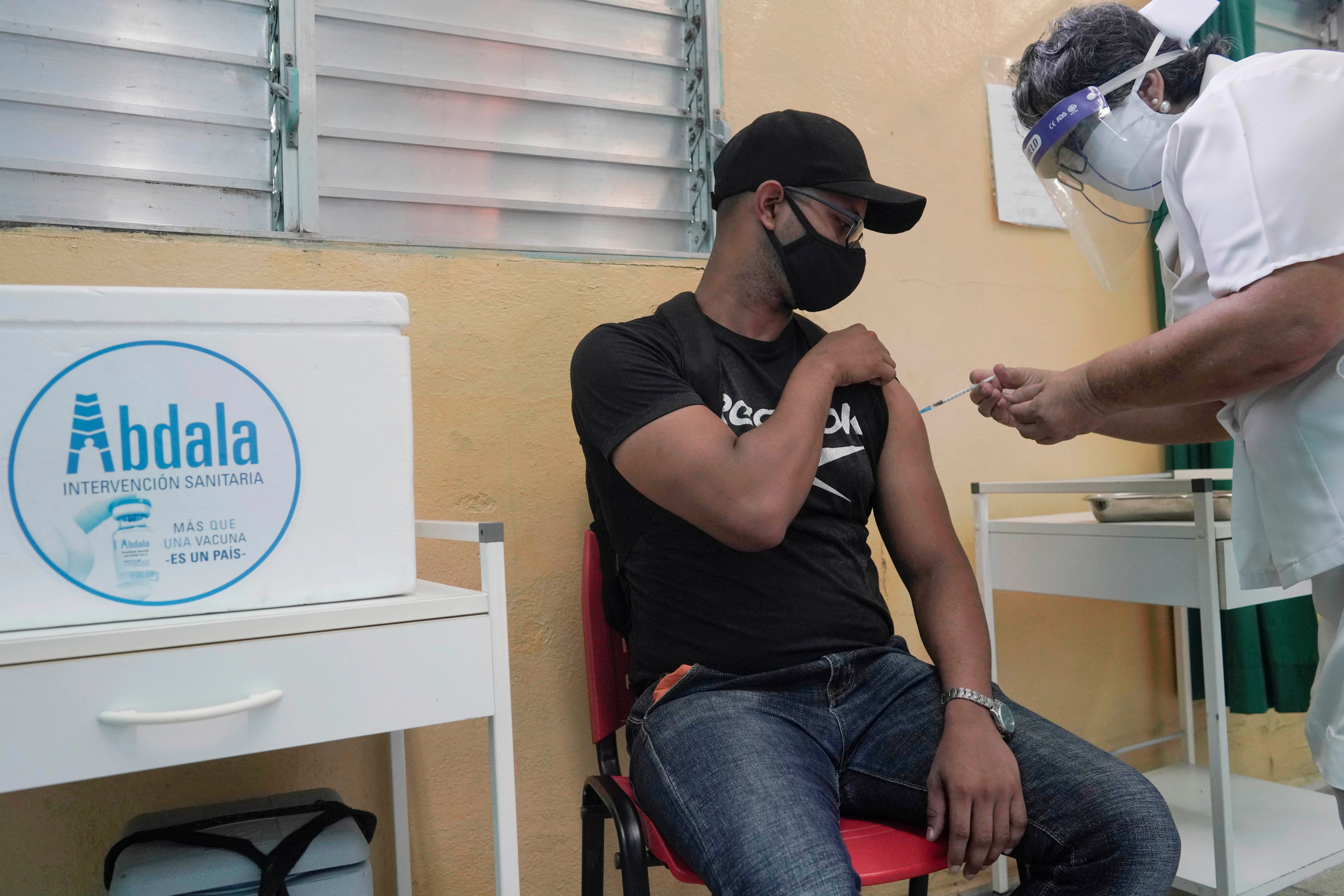 A man receives a dose of the Abdala vaccine at a vaccination center amid concerns about the spread of the coronavirus disease (COVID-19), in Havana, Cuba, August 2, 2021. REUTERS/Alexandre Meneghini