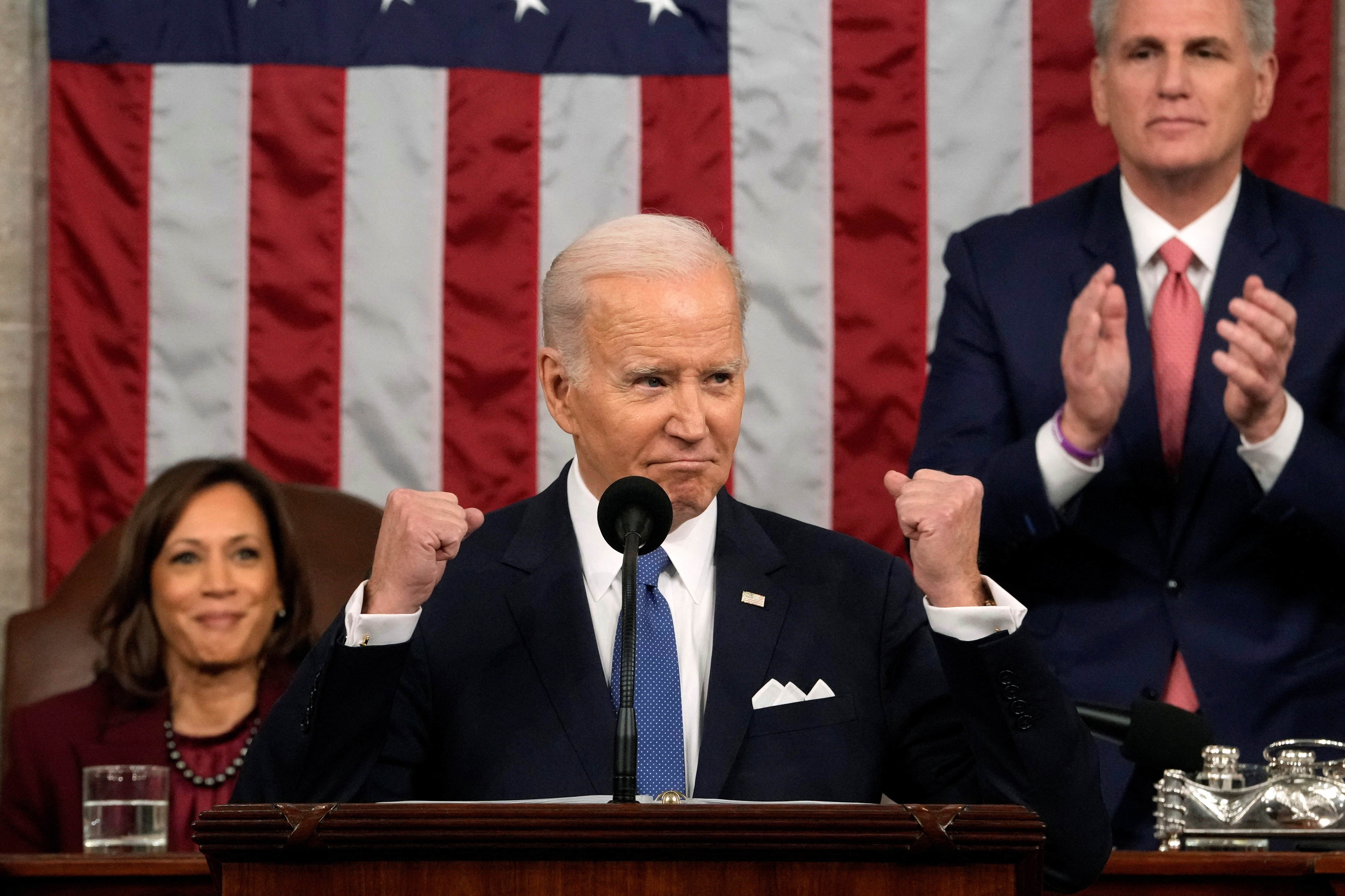 US President Joe Biden, with Vice President Kamala Harris and House Speaker Kevin McCarthy behind him, delivers the State of the Union address to a joint session of Congress at the US Capitol.