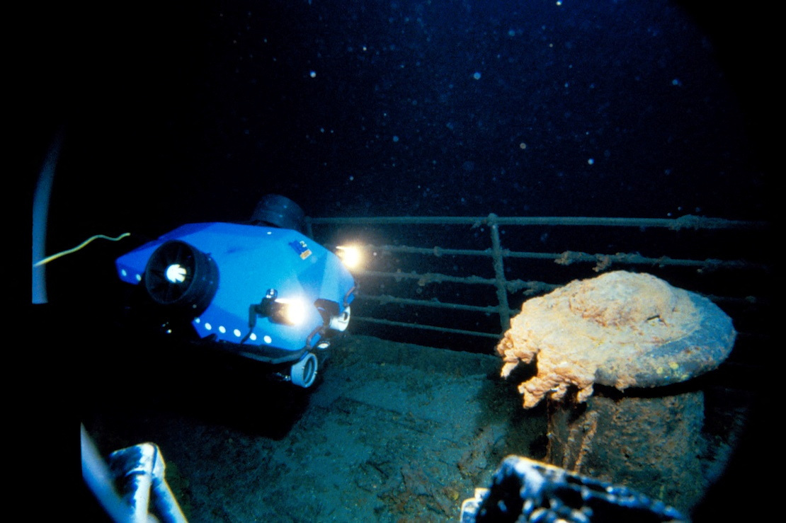 A submersible travels along the sunken Titanic's deck