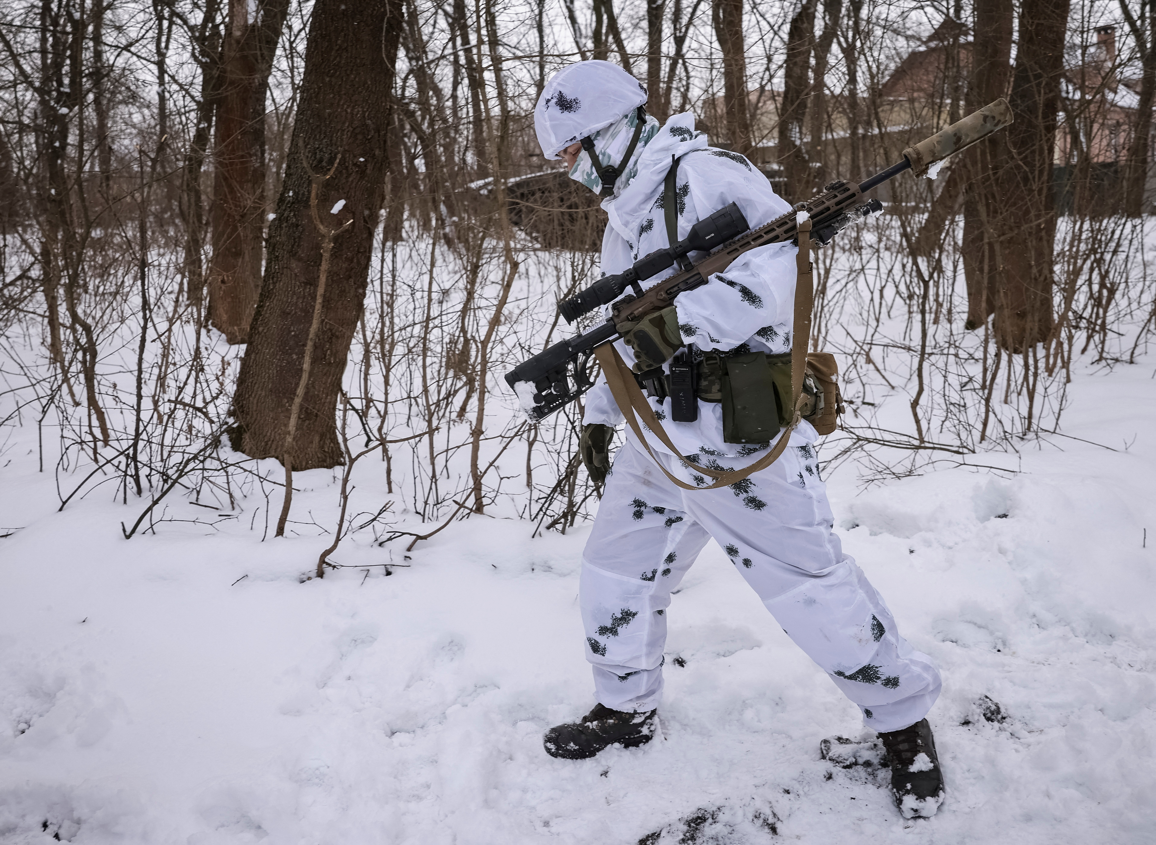A Ukrainian sniper walks with his weapon, as Russia's attack on Ukraine continues, in the front line city of Bakhmut, Ukraine