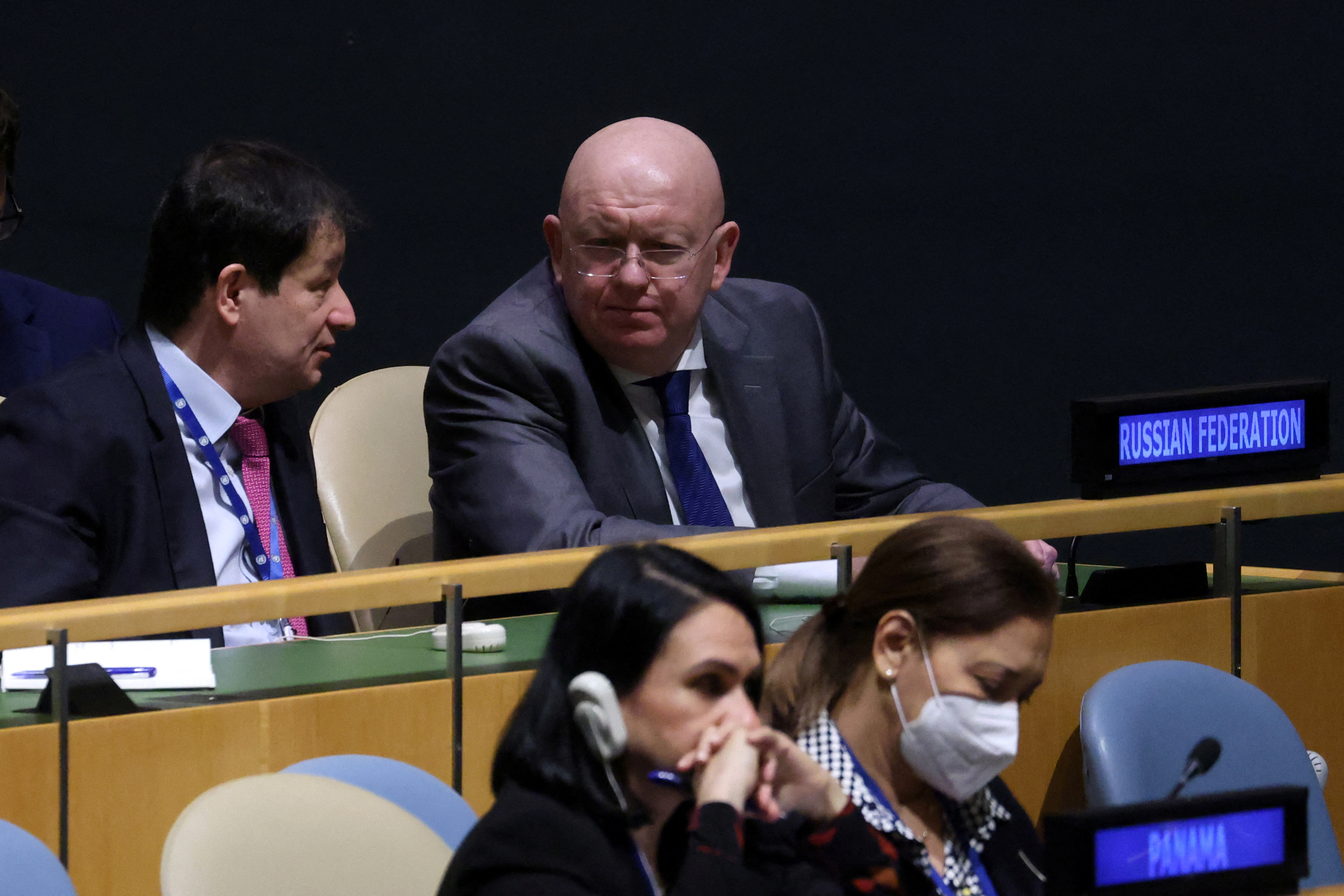 Russia's Ambassador to the United Nations Vasily Nebenzya after the vote on the resolution. He is listening to a colleague and looks glum.