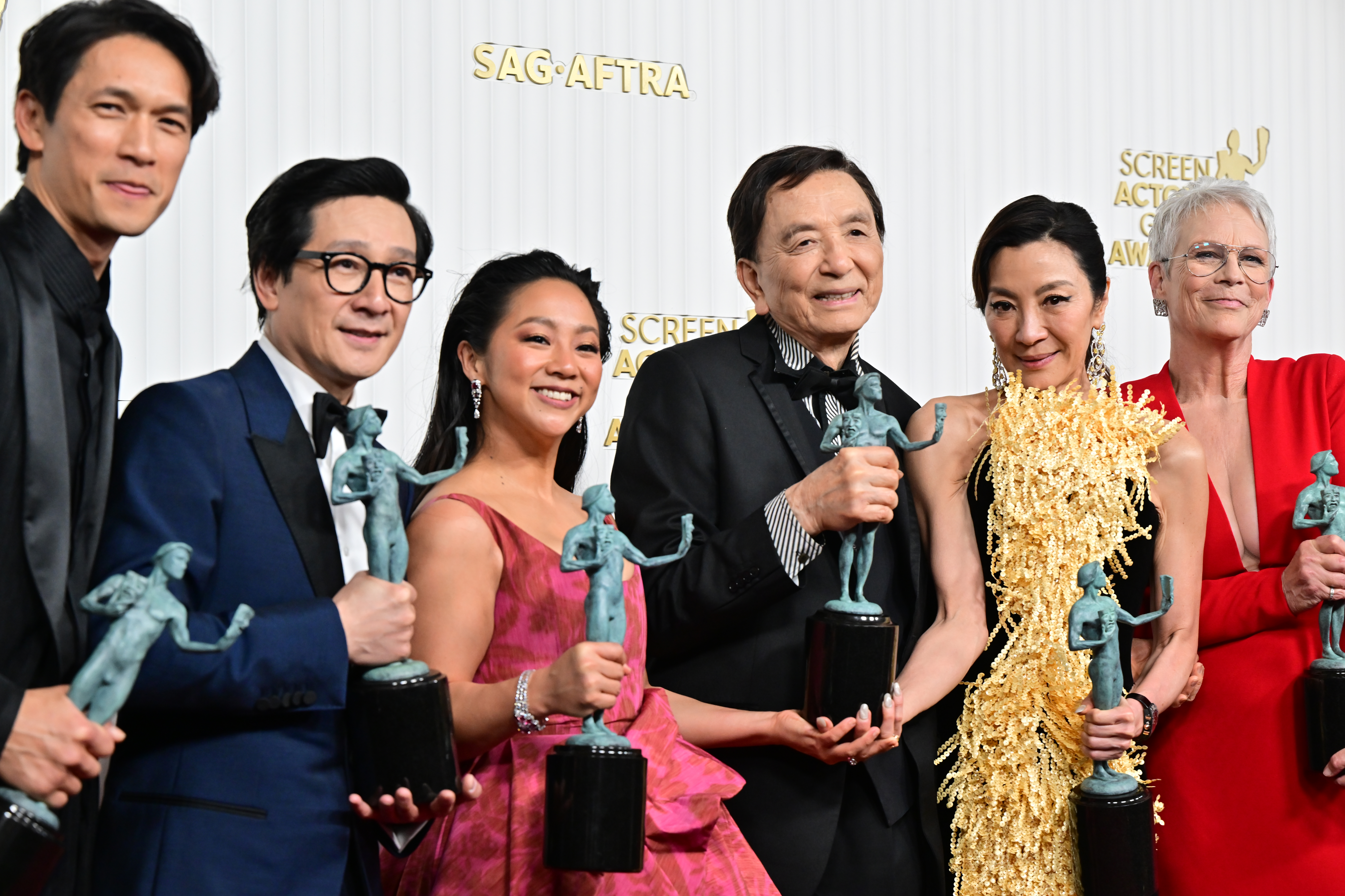 The cast of Everything Everywhere hold their awards